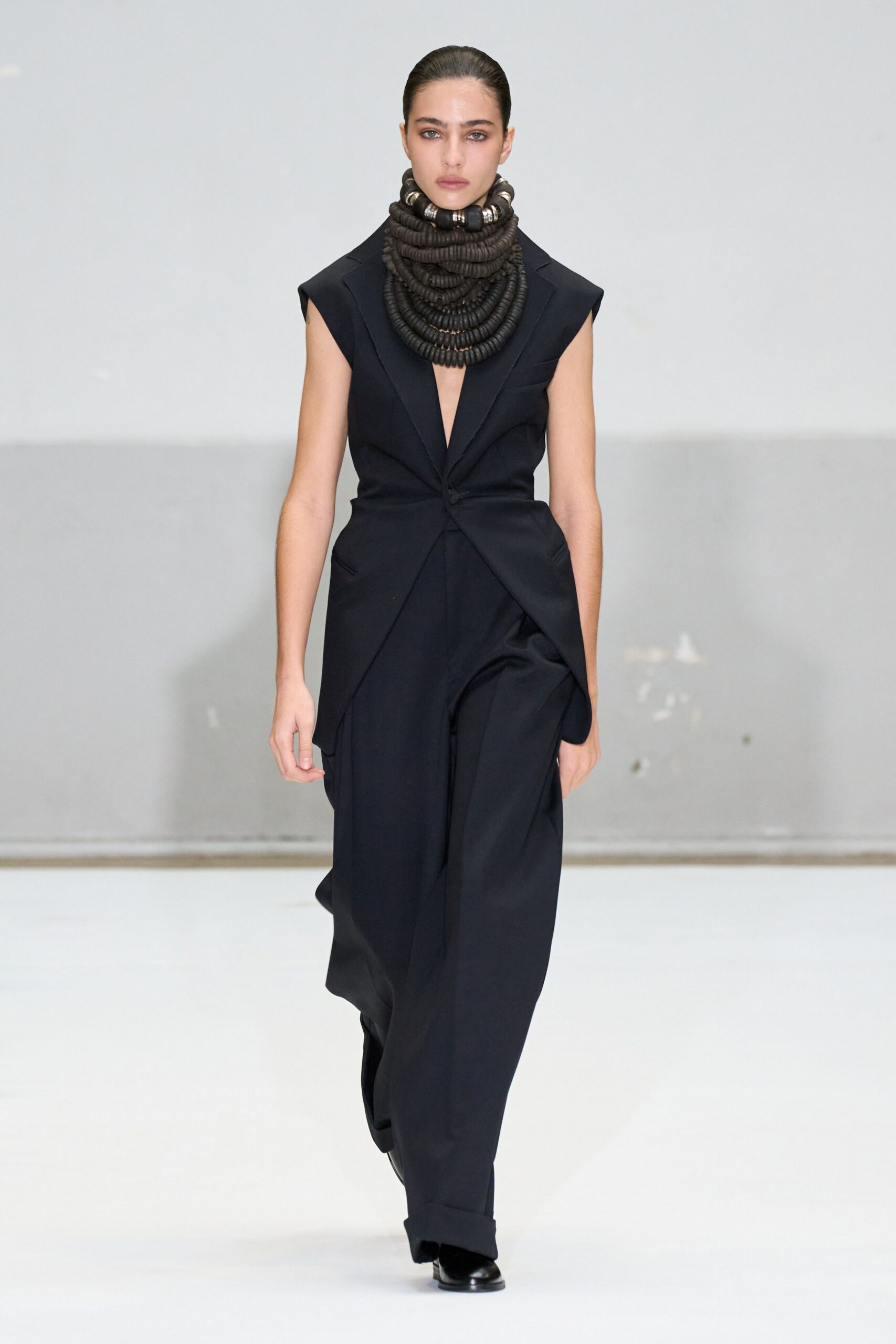 black fitted jumpsuit with neckpiece
