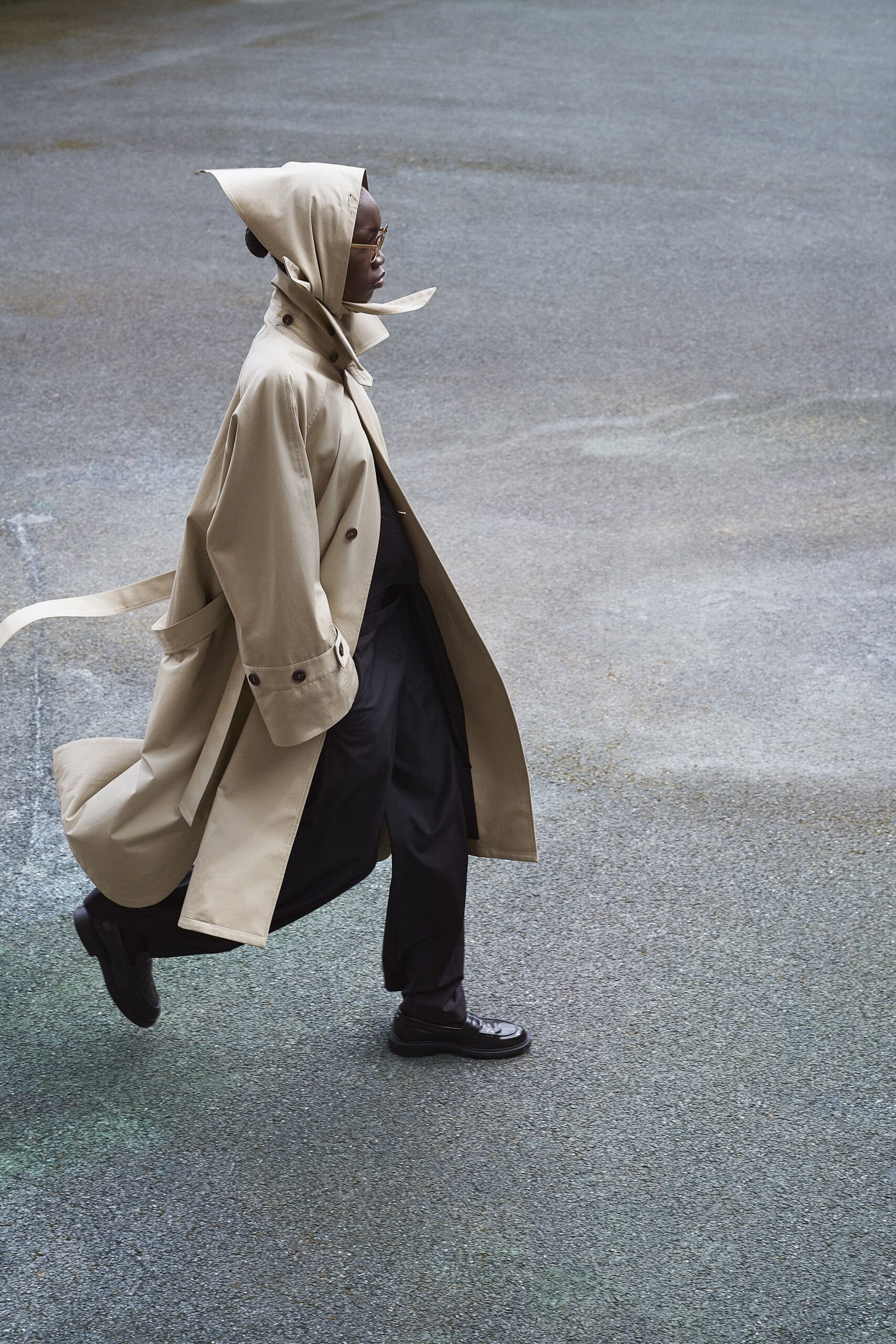 beige trench coat with black pants