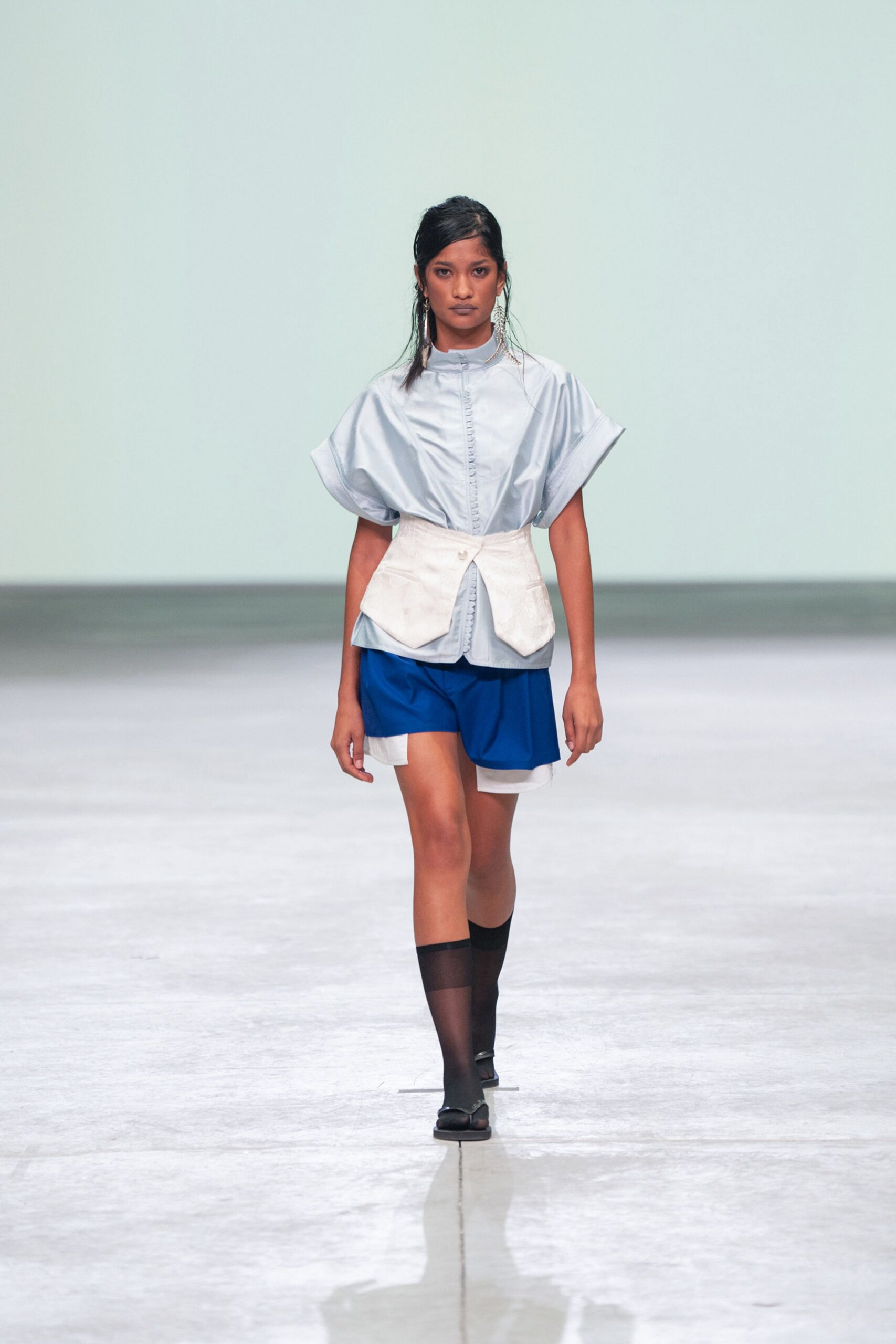 silver relaxed top with blue shorts