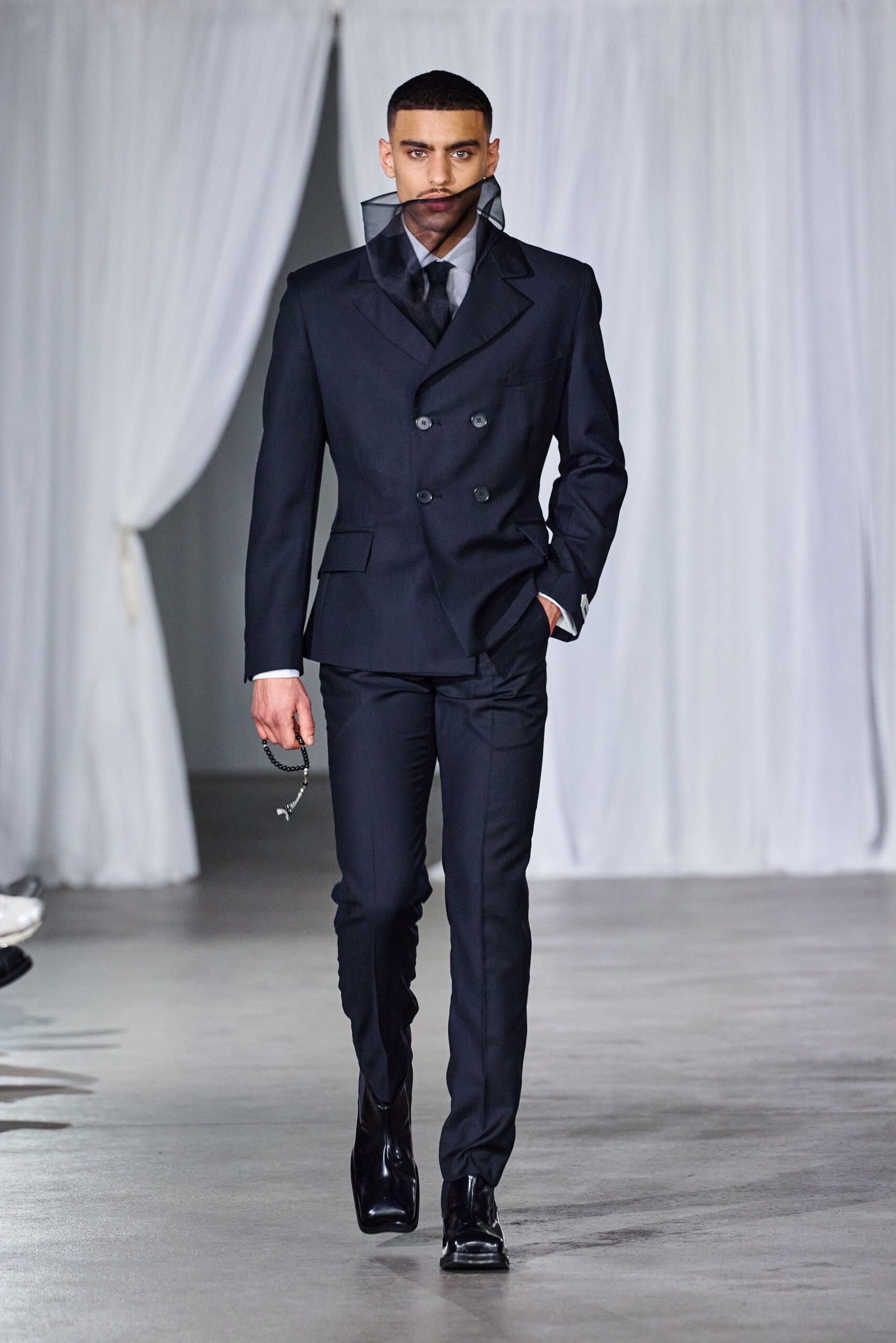 black tailored suit with sunglasses