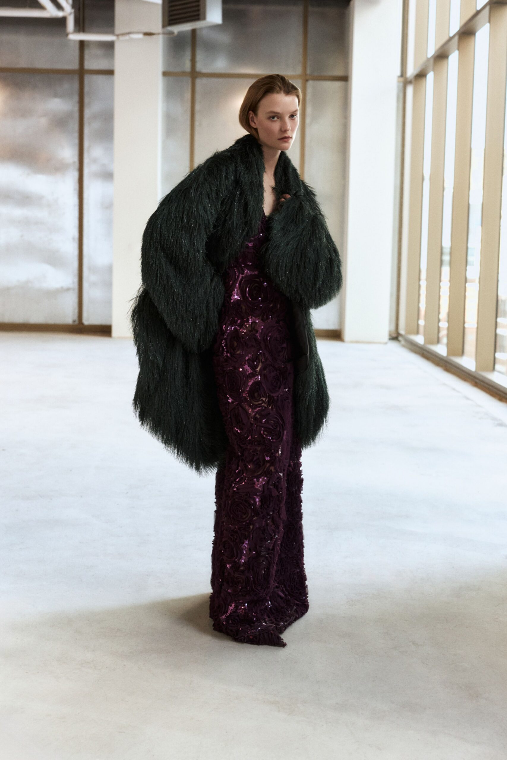 purple sequin gown with fur coat