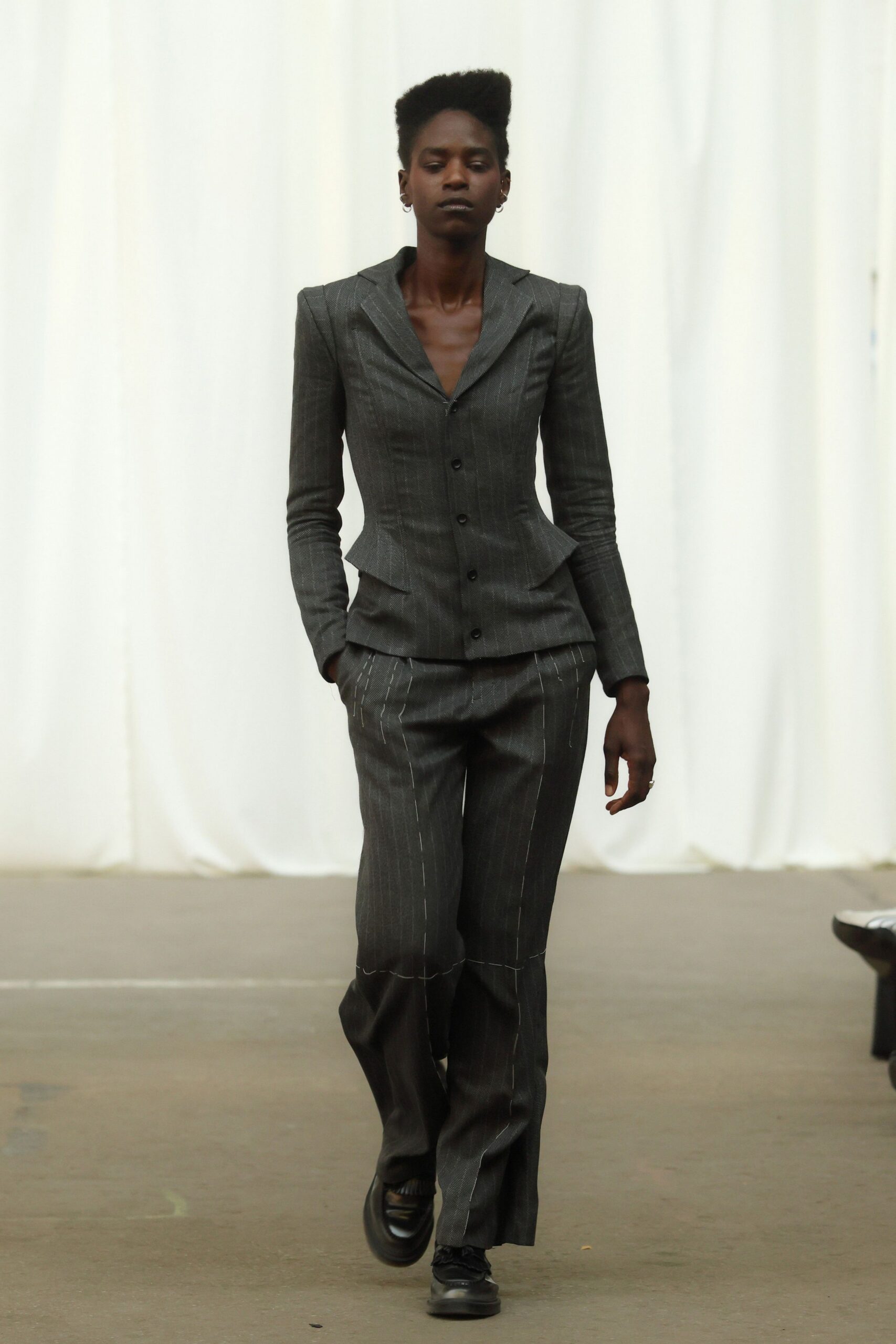 gray tailored suit with black shoes