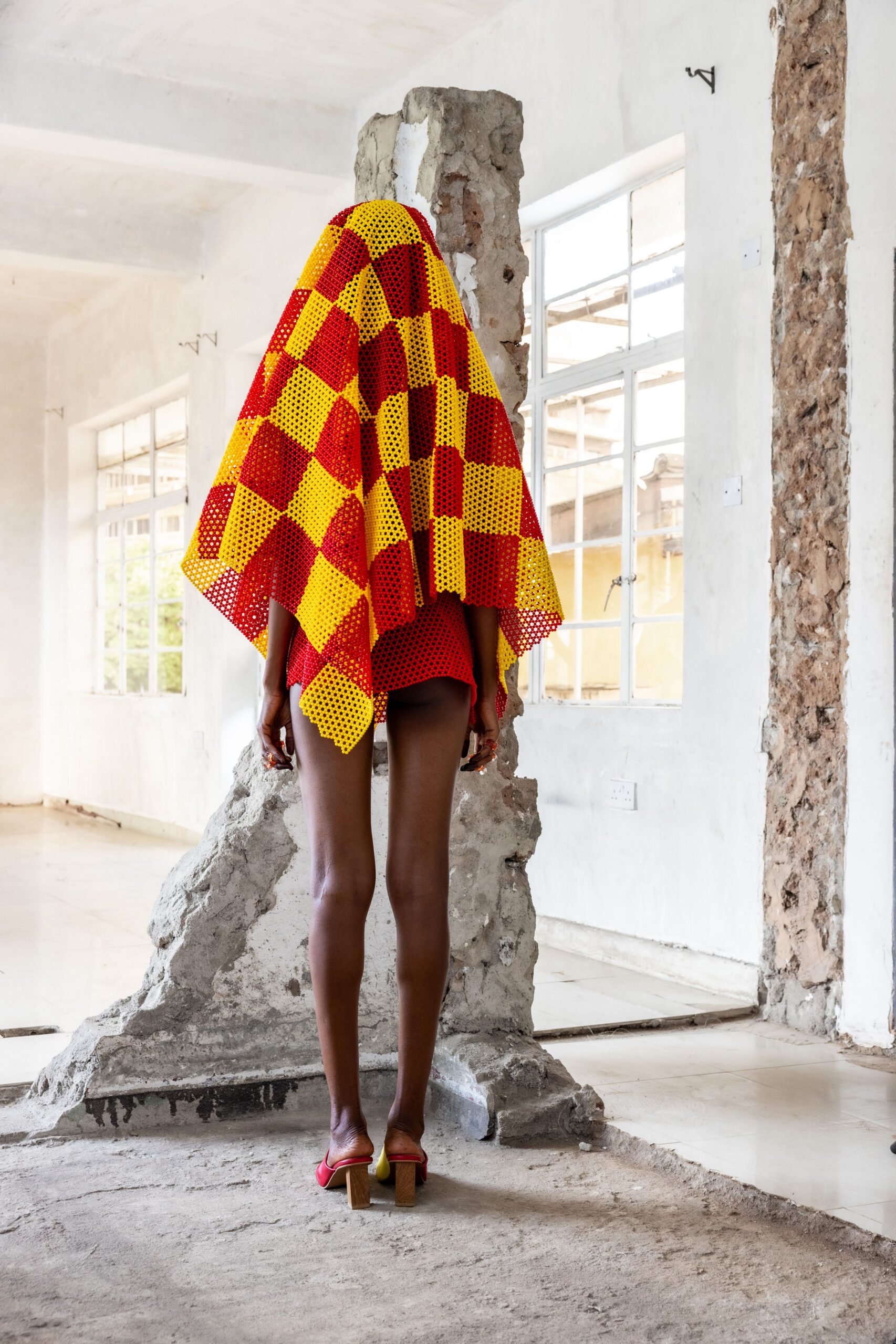 red and yellow printed mini dress with pink shoes