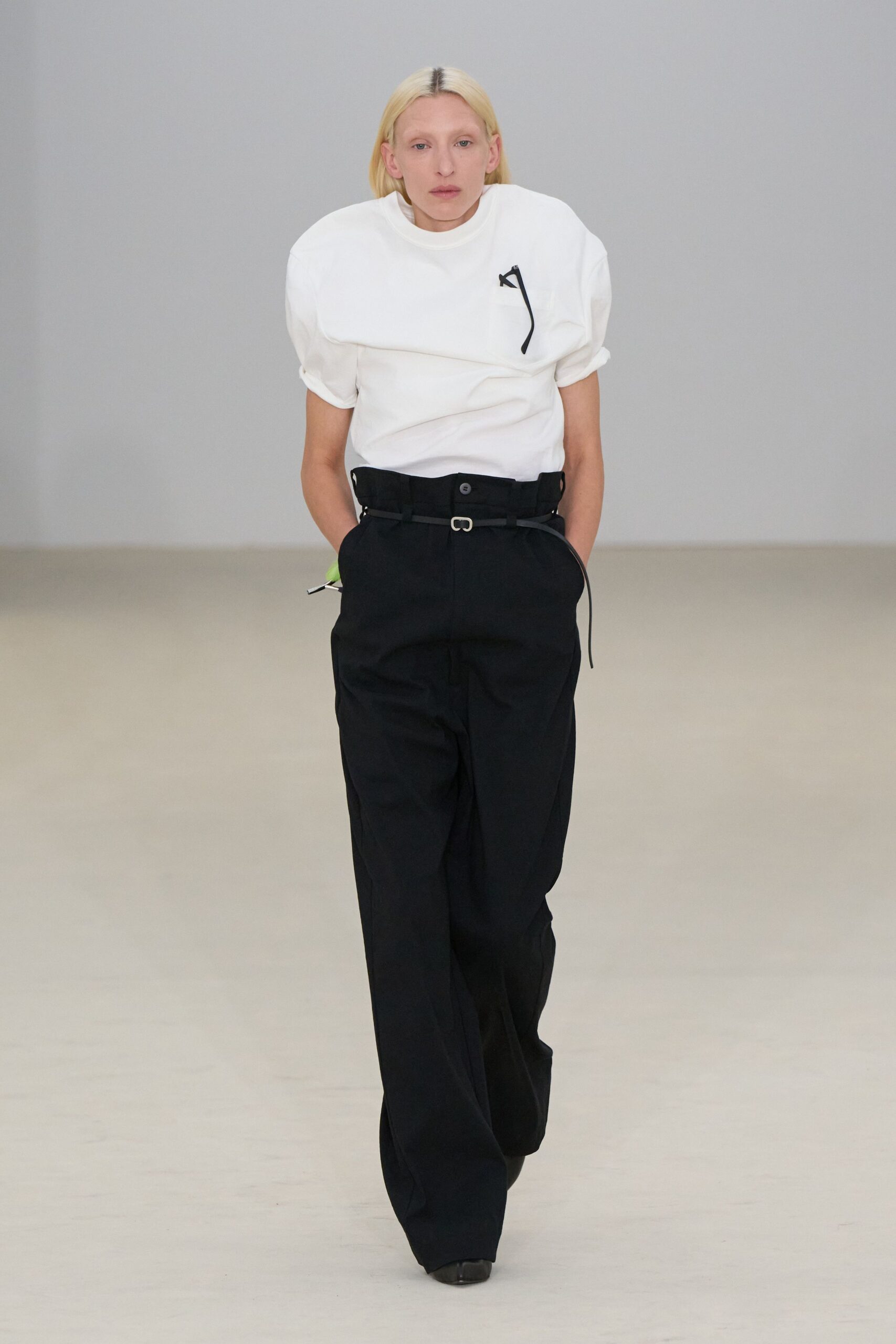 white relaxed top with black pants