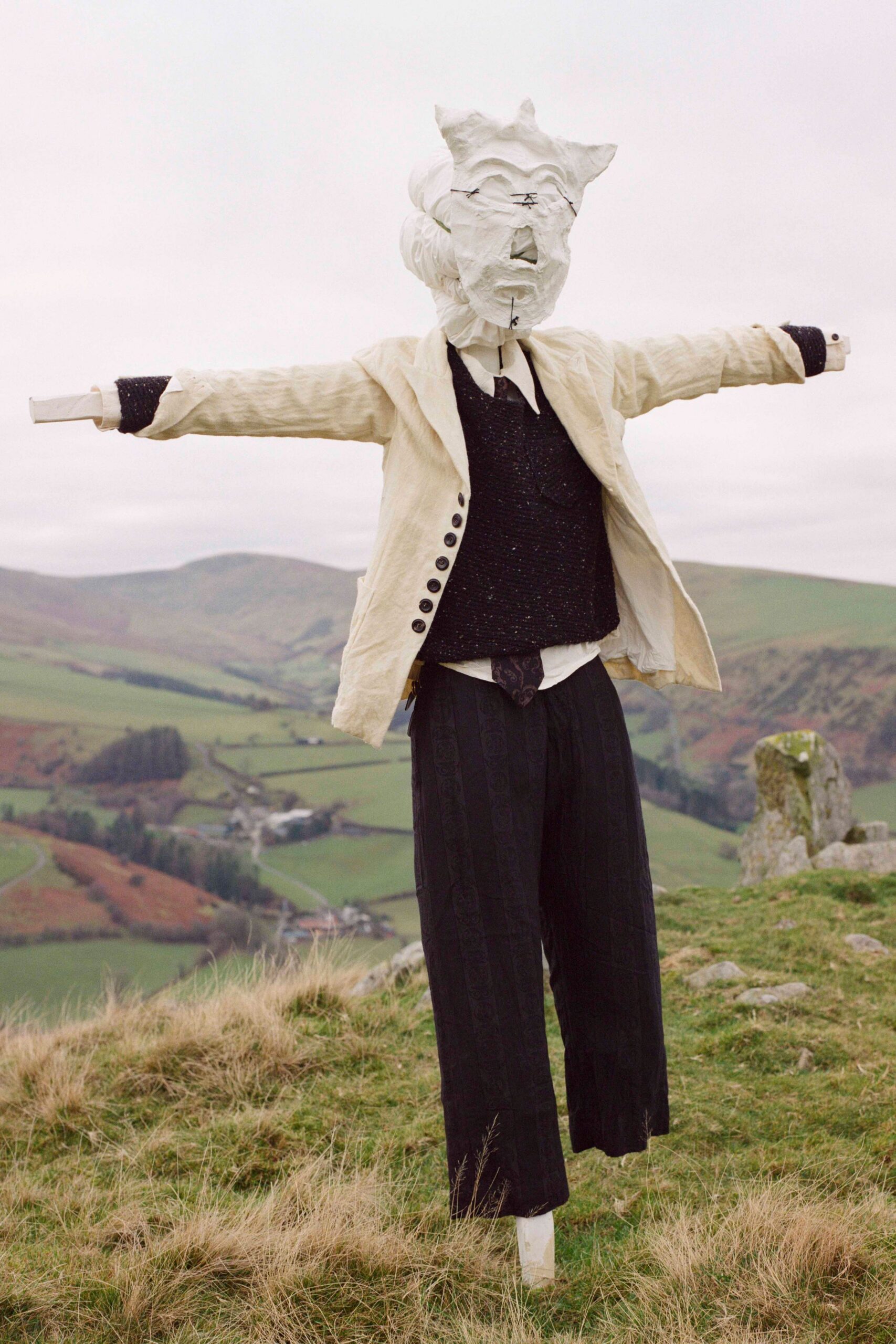 beige blazer black sweater relaxed pants