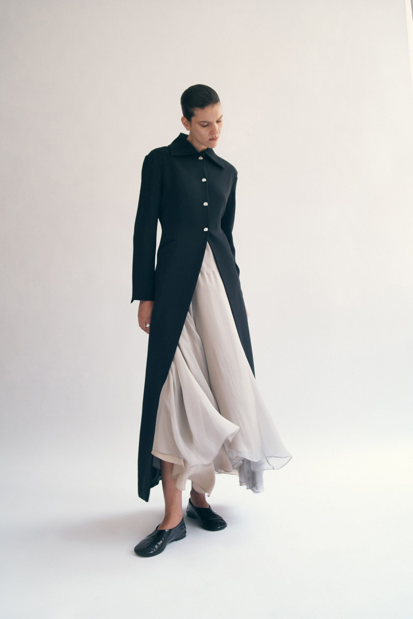 black wool coat gray tiered dress