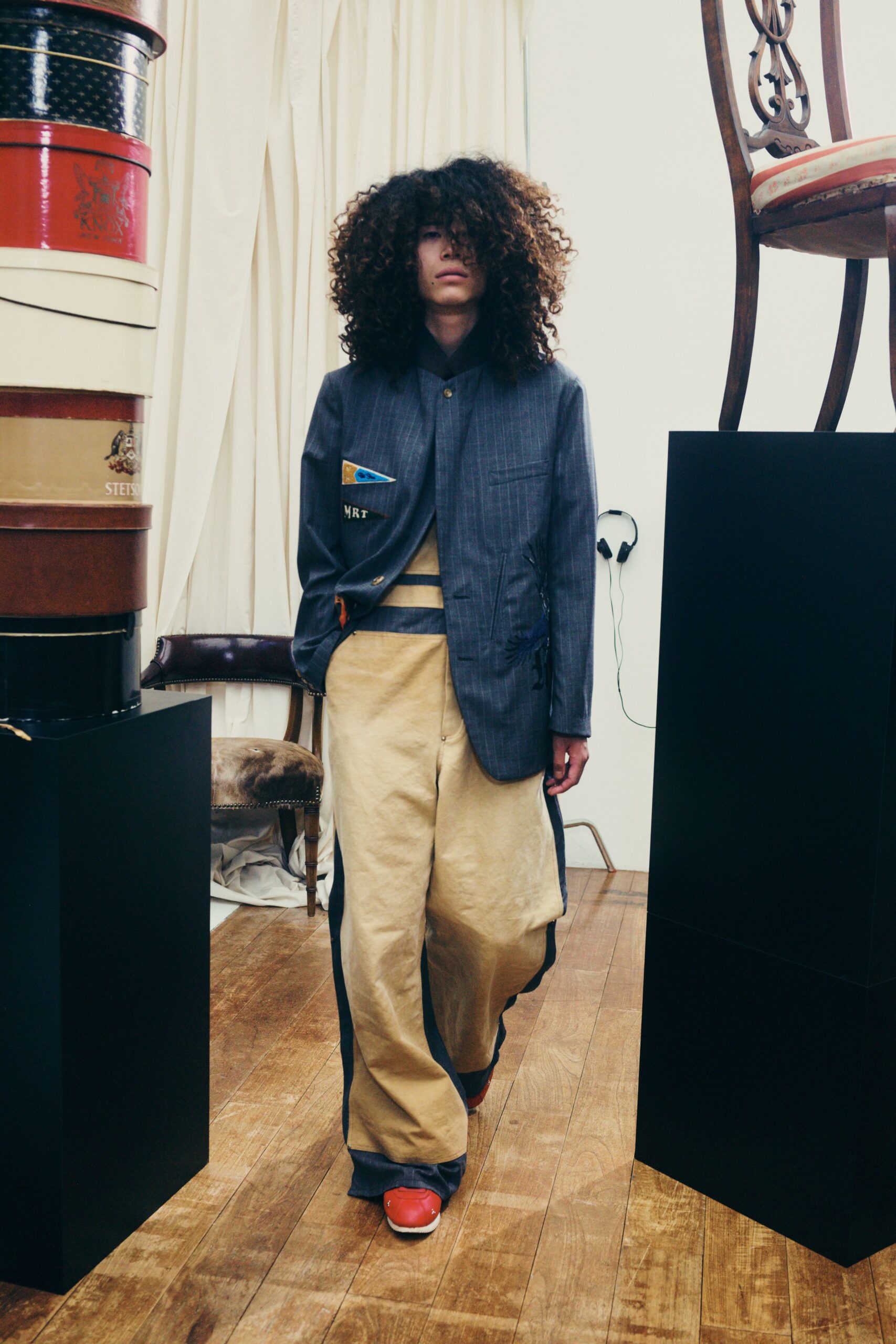 blue relaxed jacket with beige pants