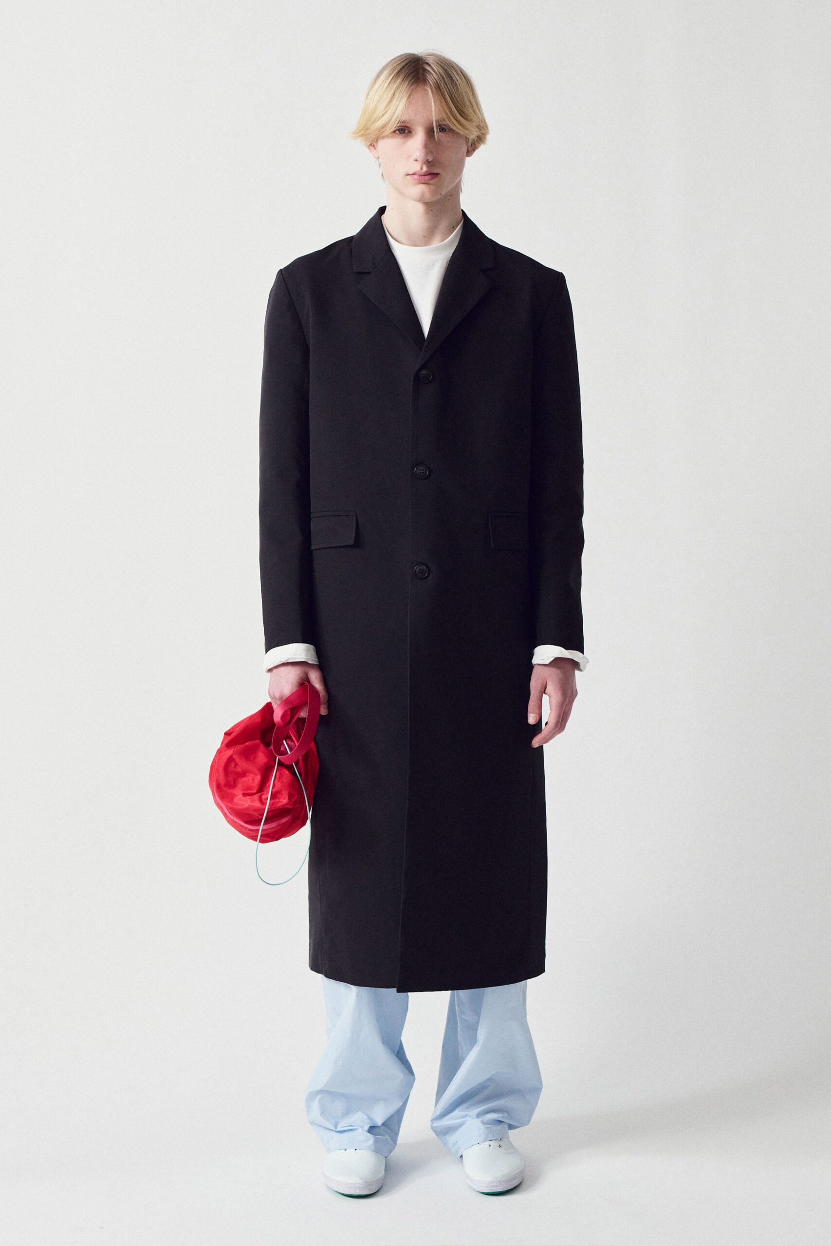black cotton long-sleeve collared relaxed buttoned coat