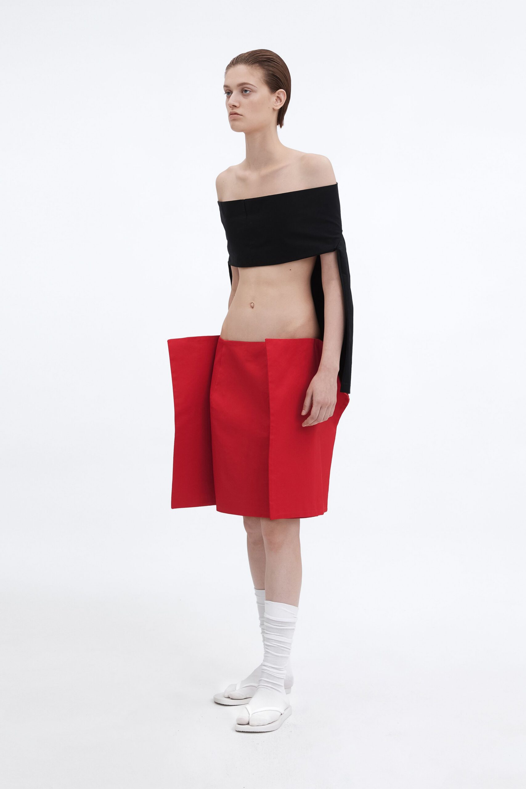 black off-shoulder top red skirt