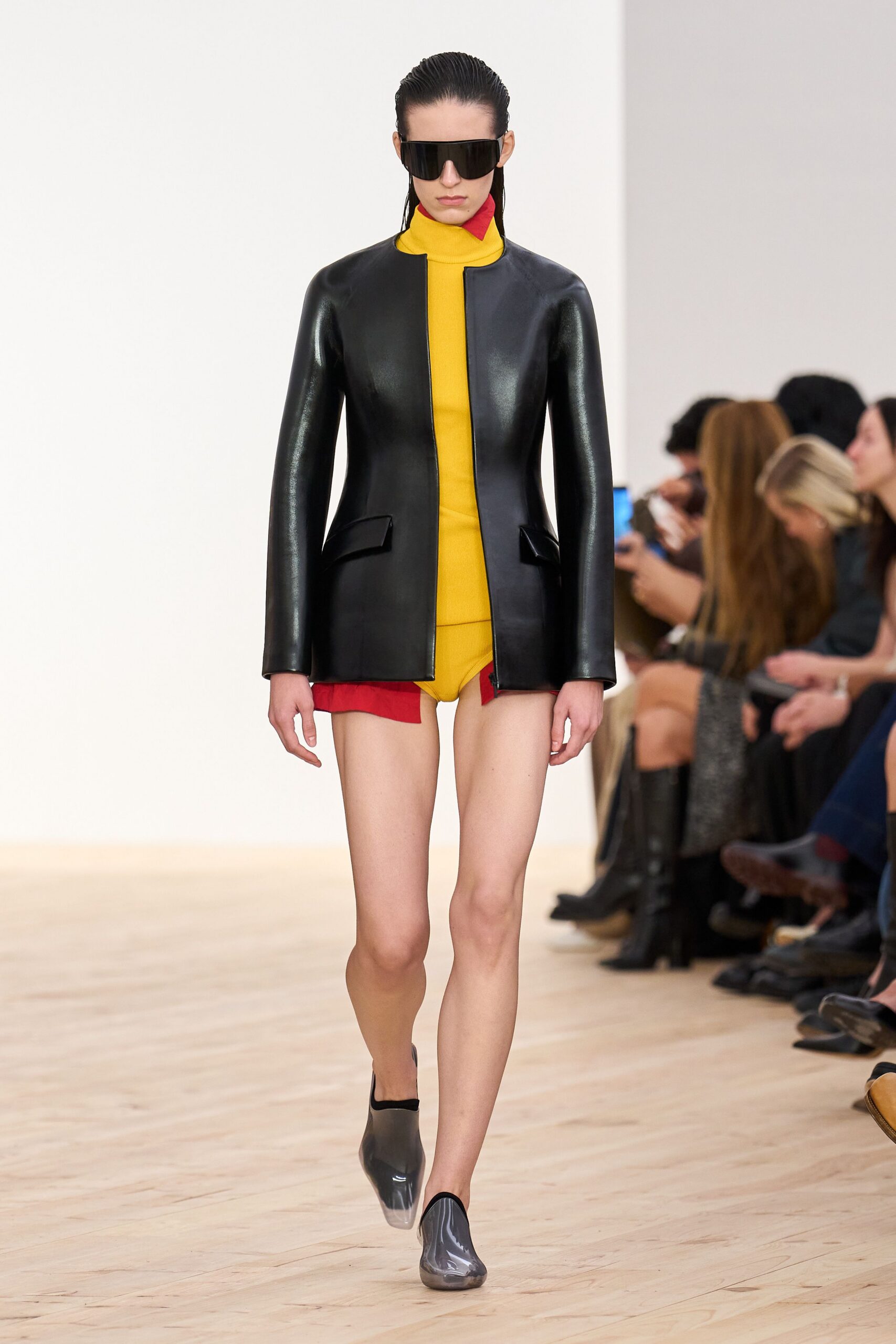 black leather jacket yellow bodysuit