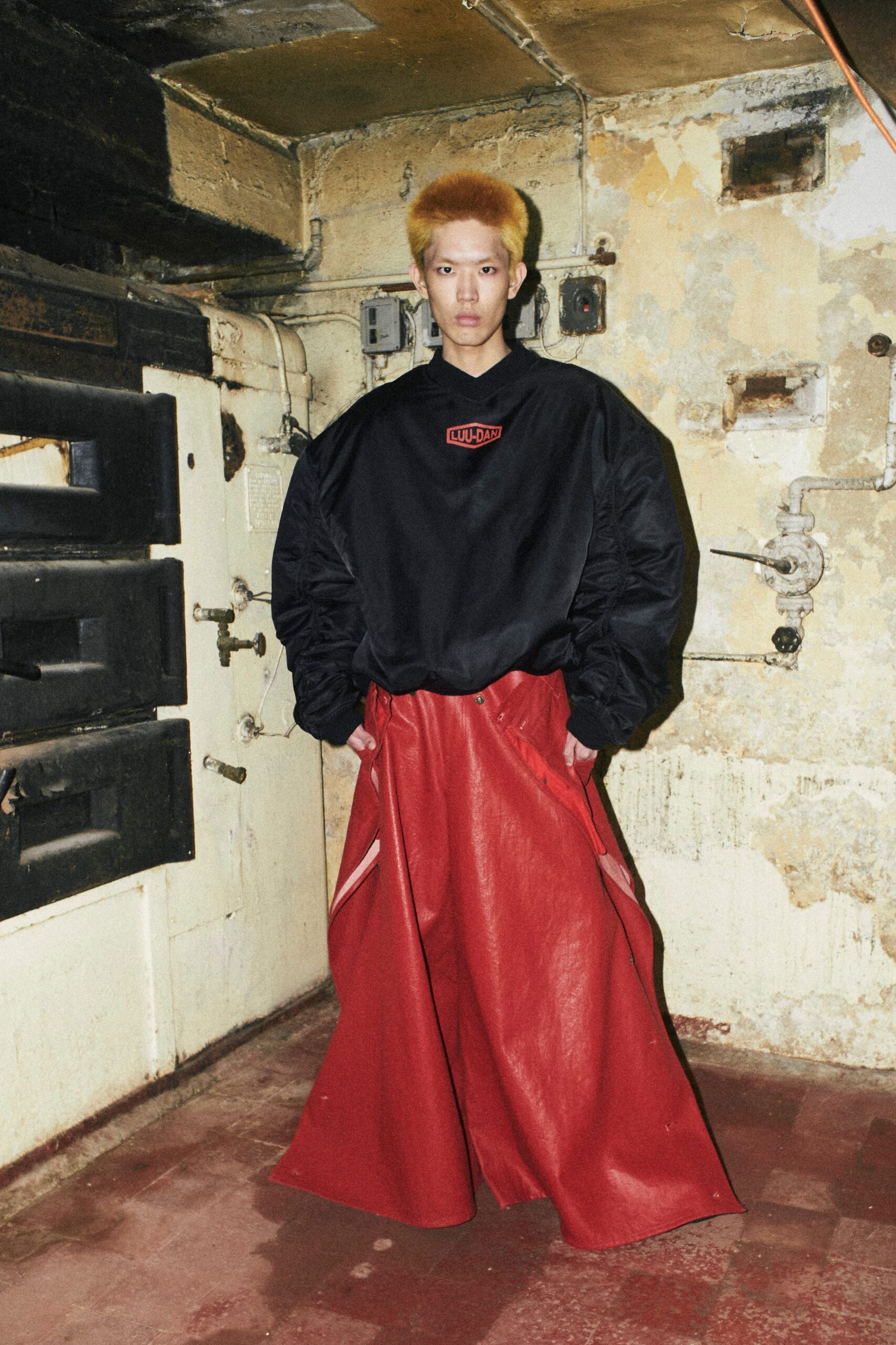 black oversized hoodie red leather pants