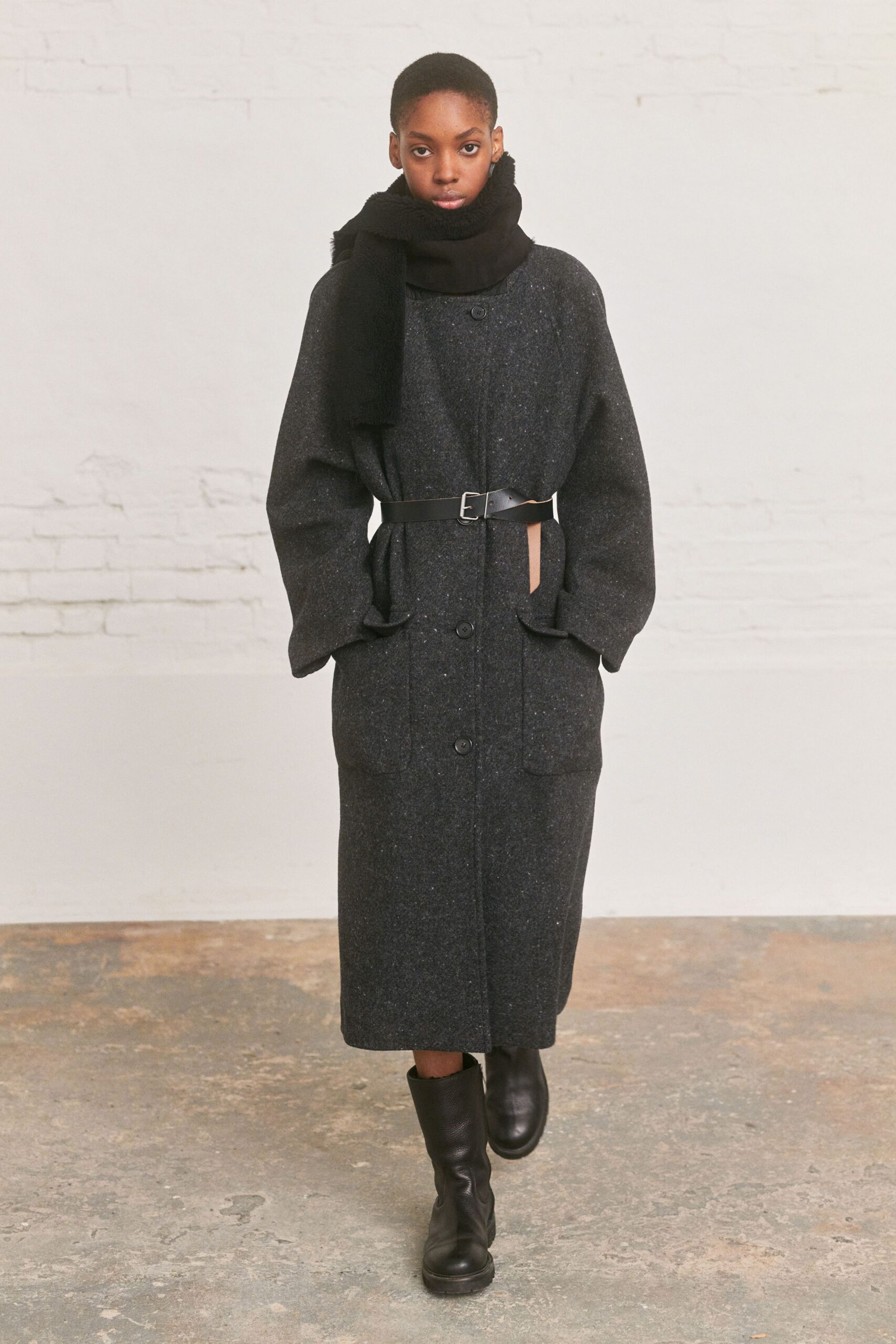 black wool coat with scarf and boots