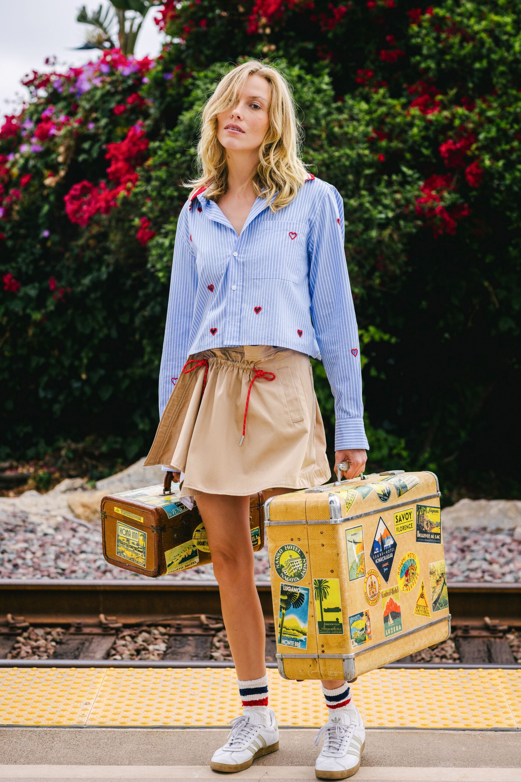 blue and white collared shirt with beige skirt