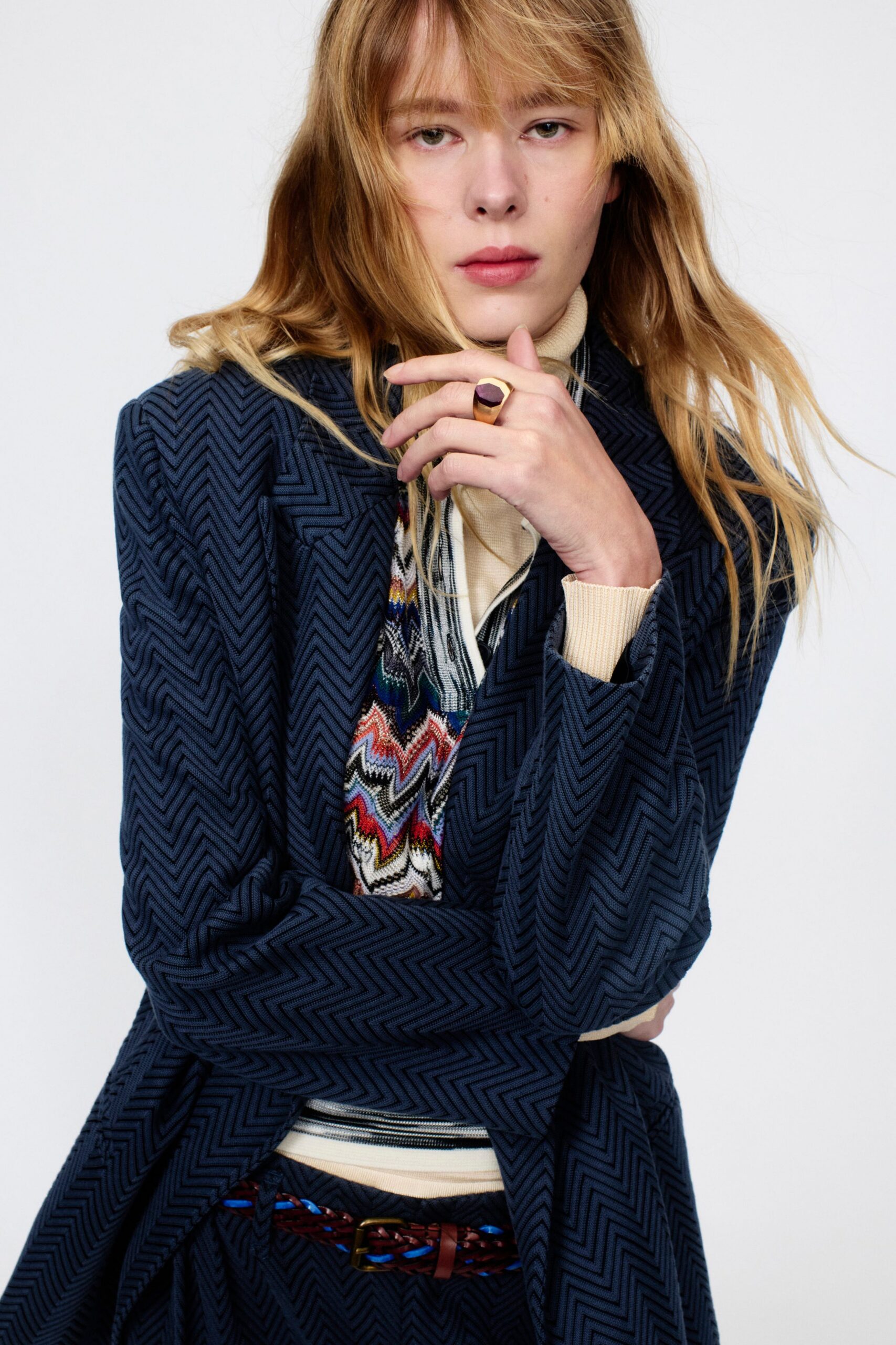 blue tailored blazer with beige shirt