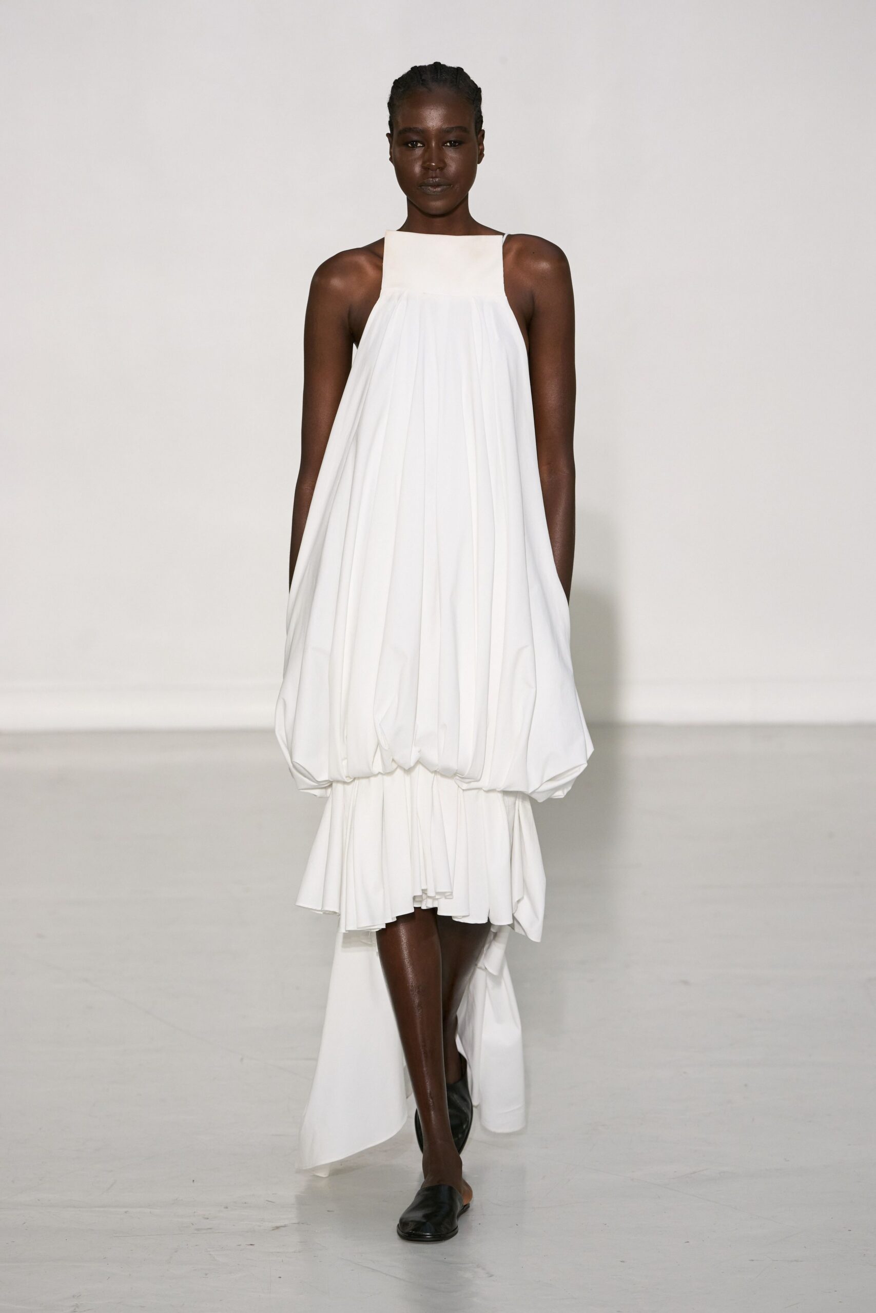 white pleated midi dress with black shoes