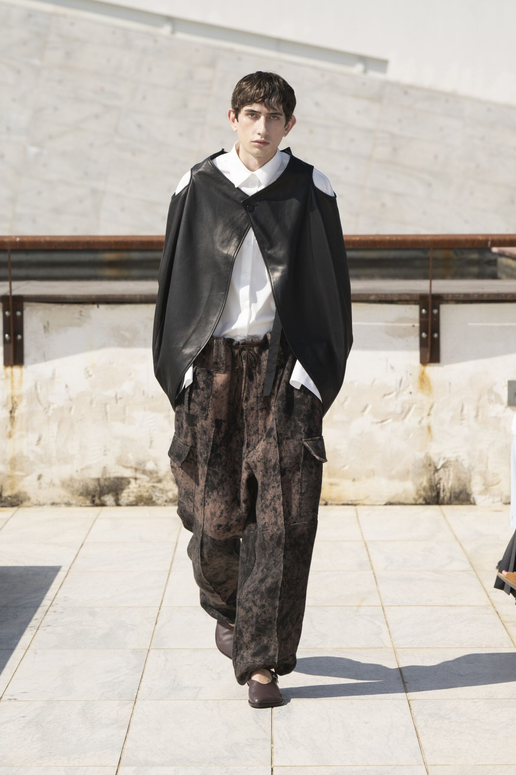 black leather cape with white shirt