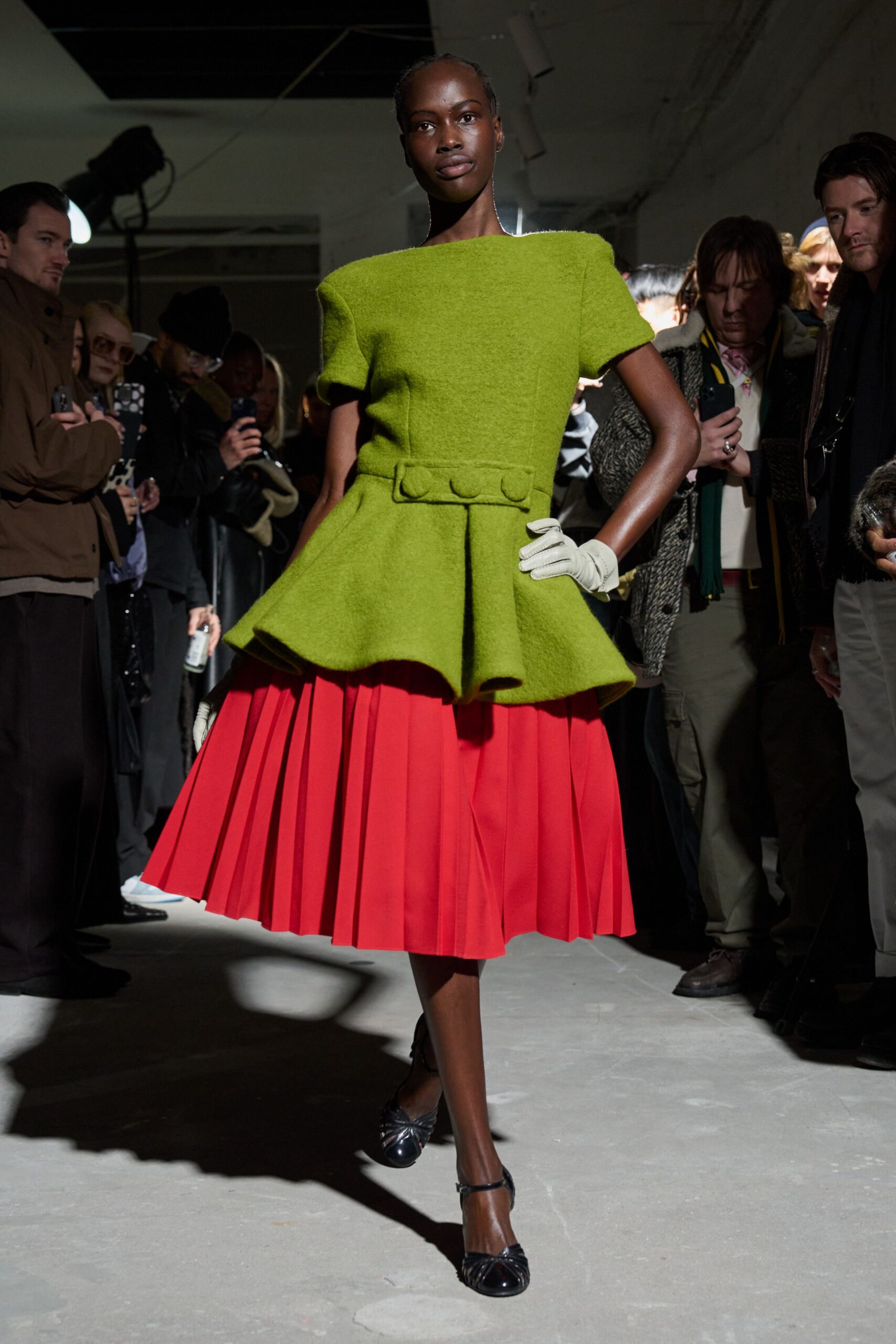 green top red pleated skirt