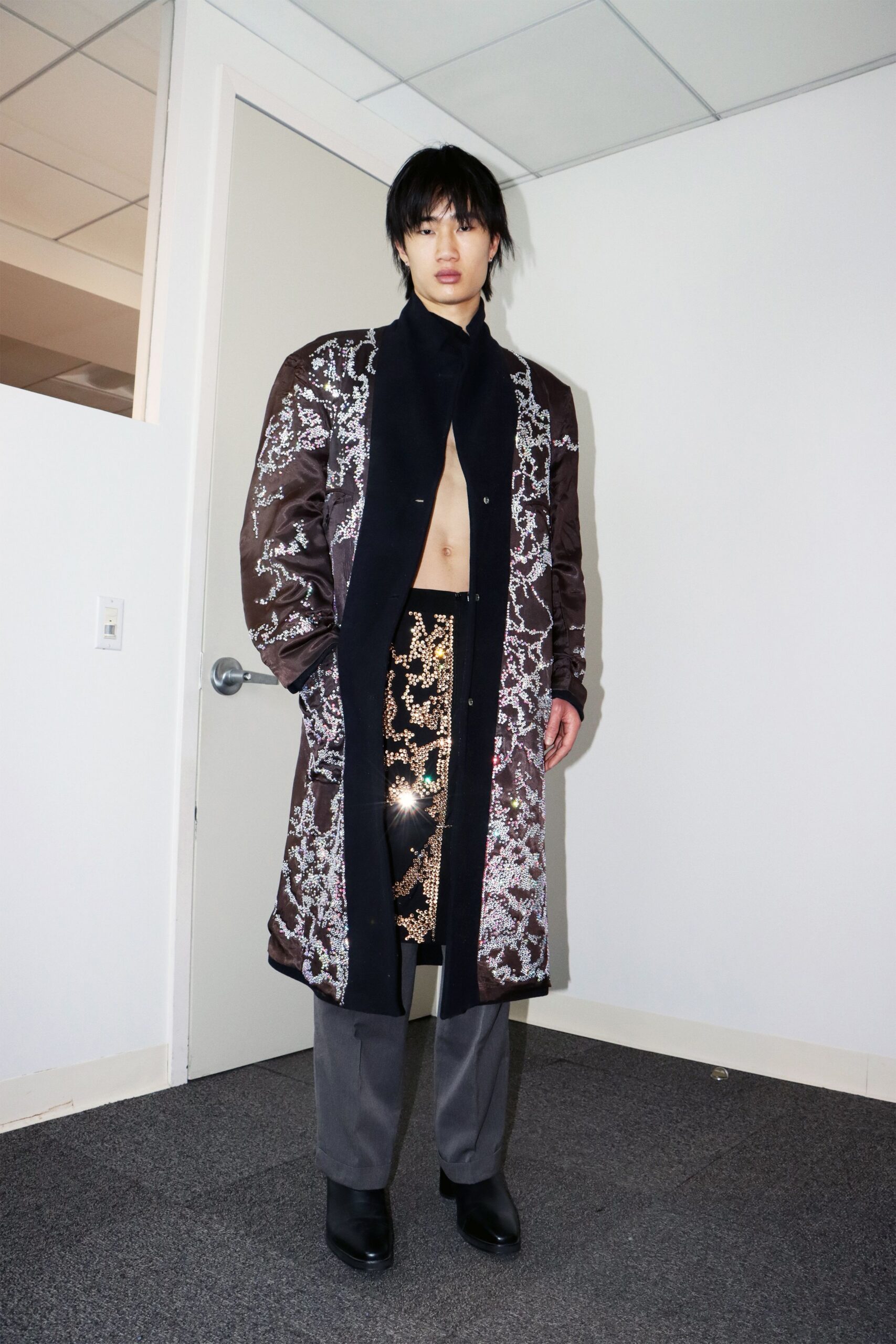black embroidered coat with gold skirt