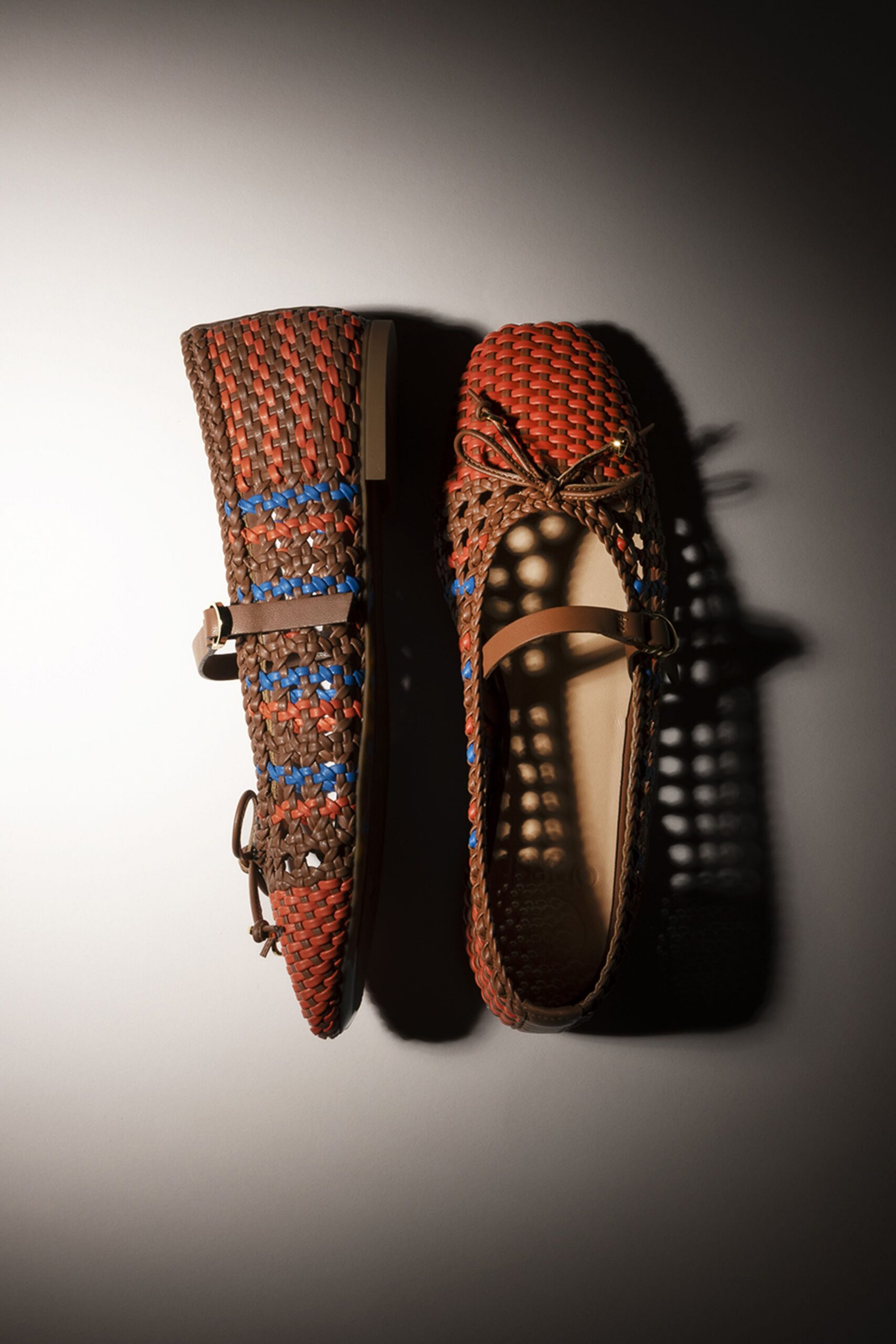 brown and red woven shoes
