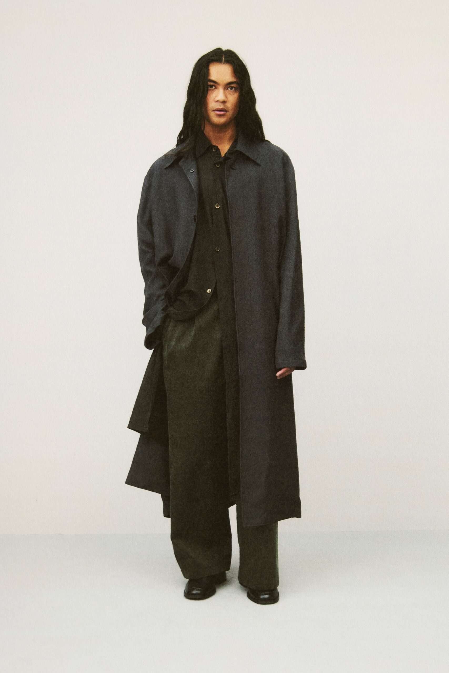 black oversized coat with relaxed shirt and pants