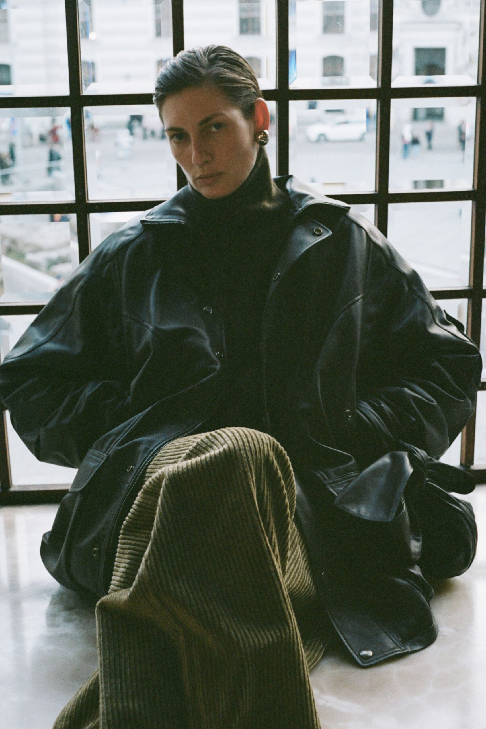 black leather long-sleeve collared oversized coat