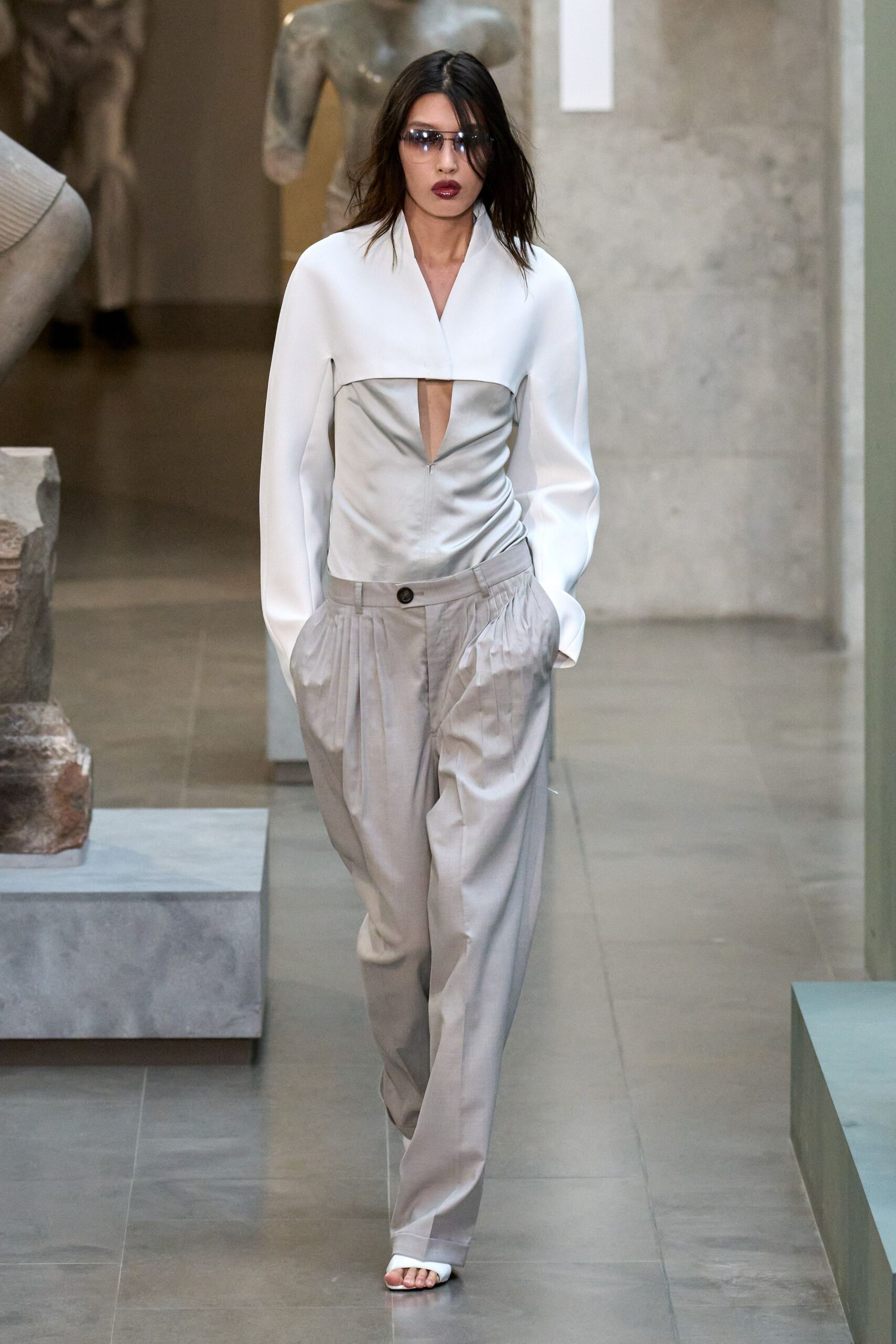 white silk fitted top gray pants