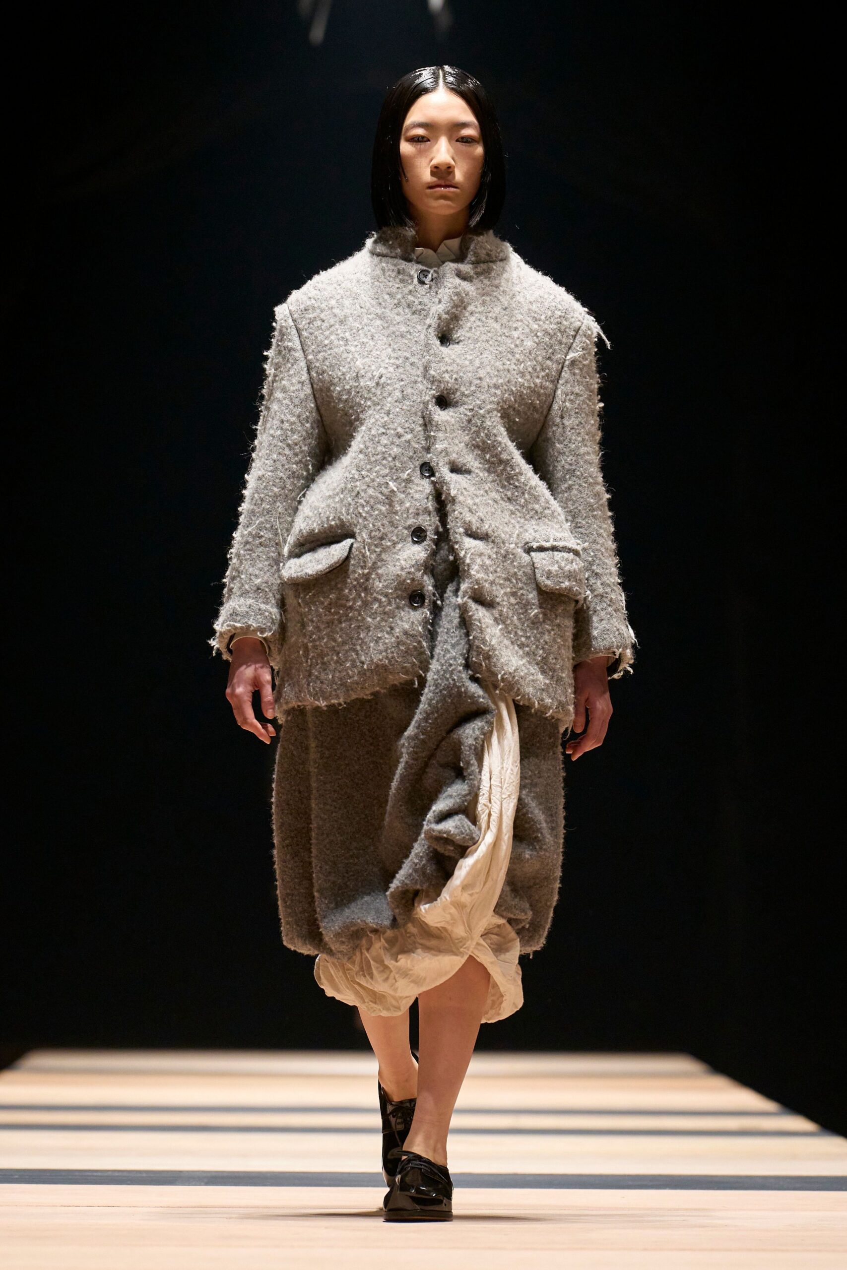 gray wool coat with beige skirt