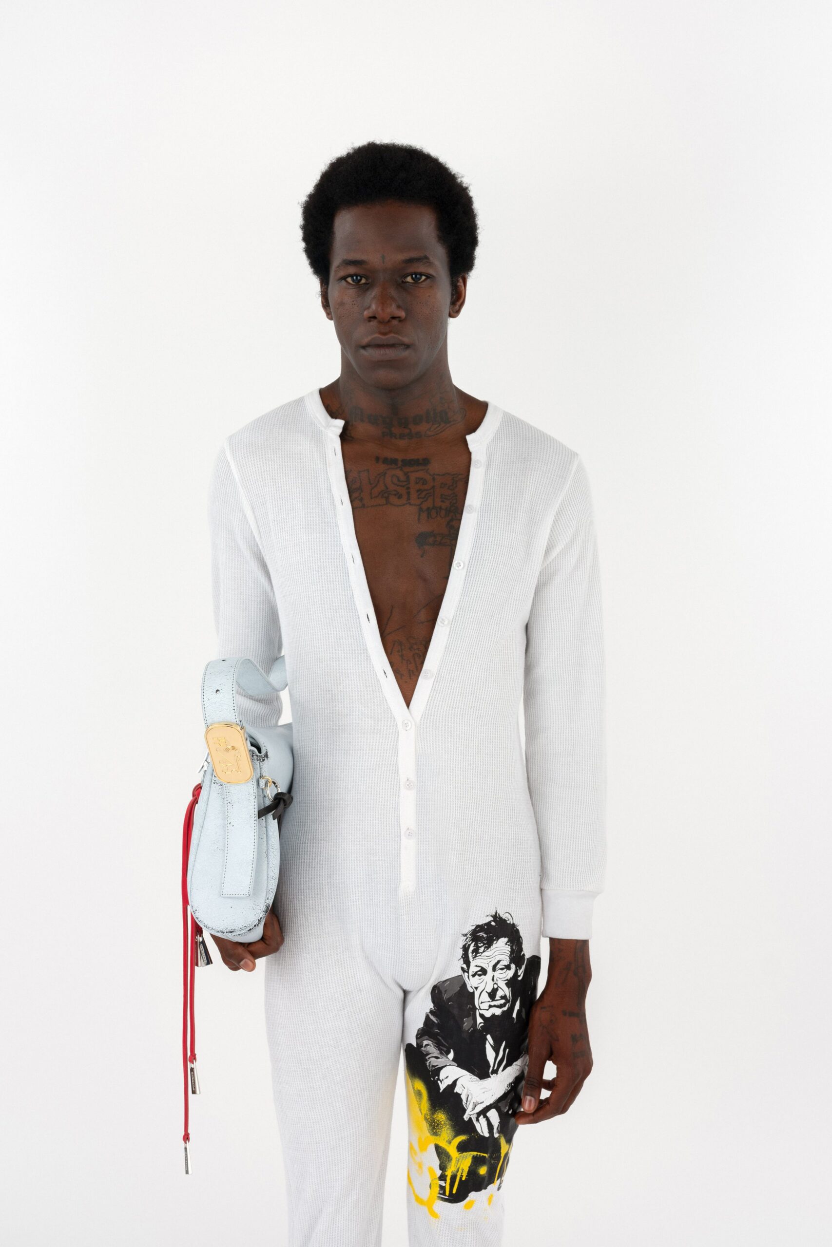 white fitted jumpsuit with blue shoes