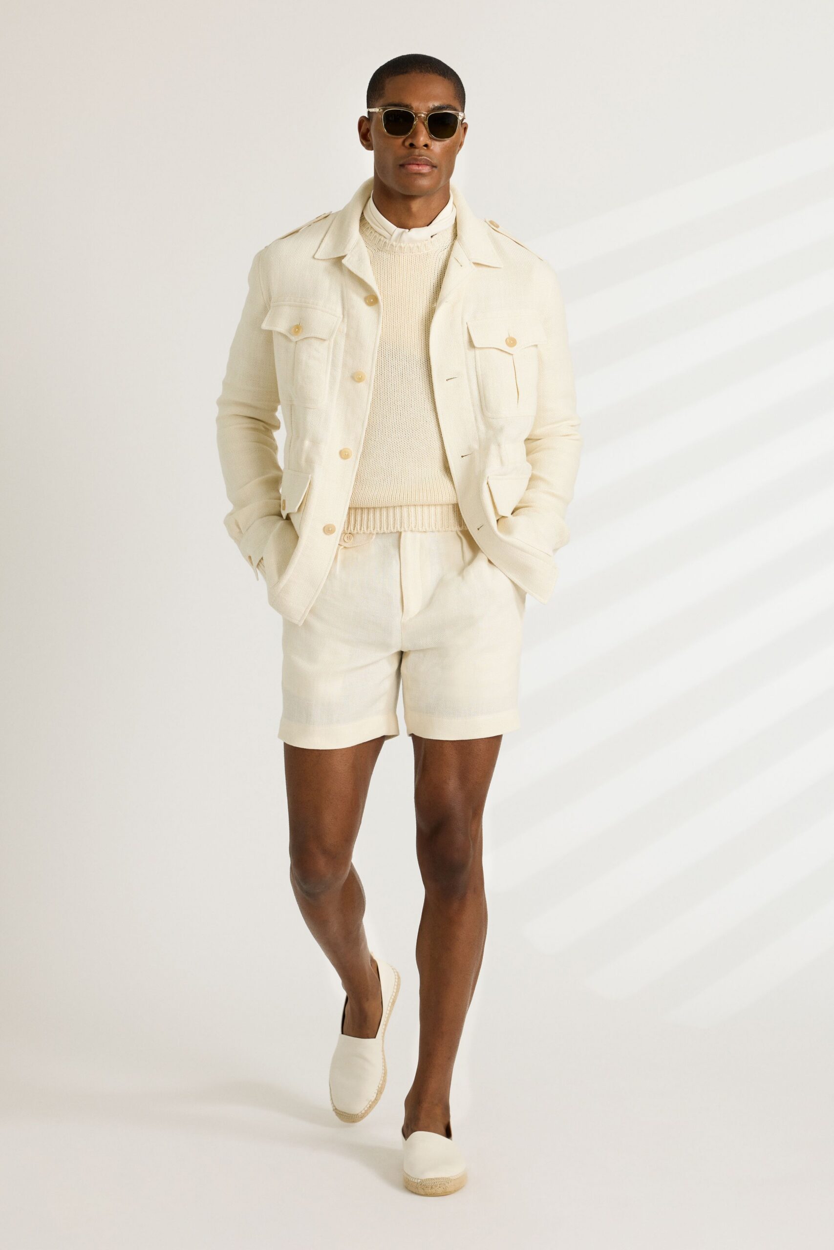 white jacket beige sweater shorts