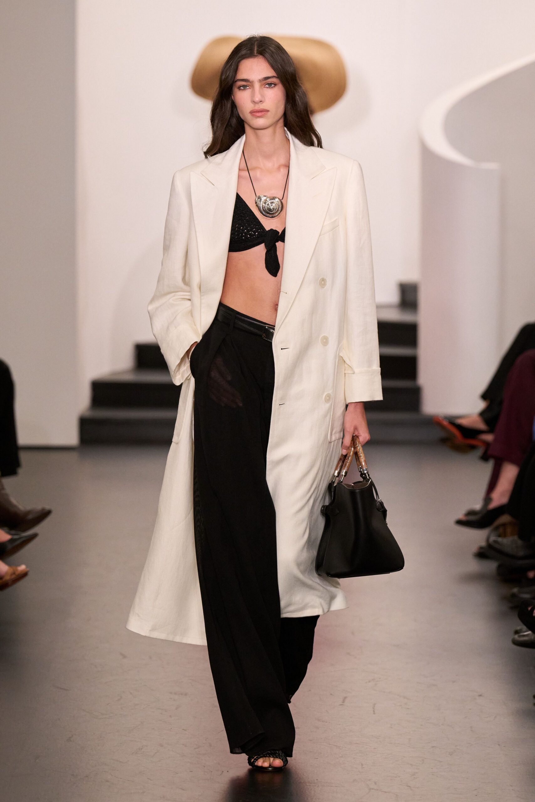 white coat black bra wide-leg pants