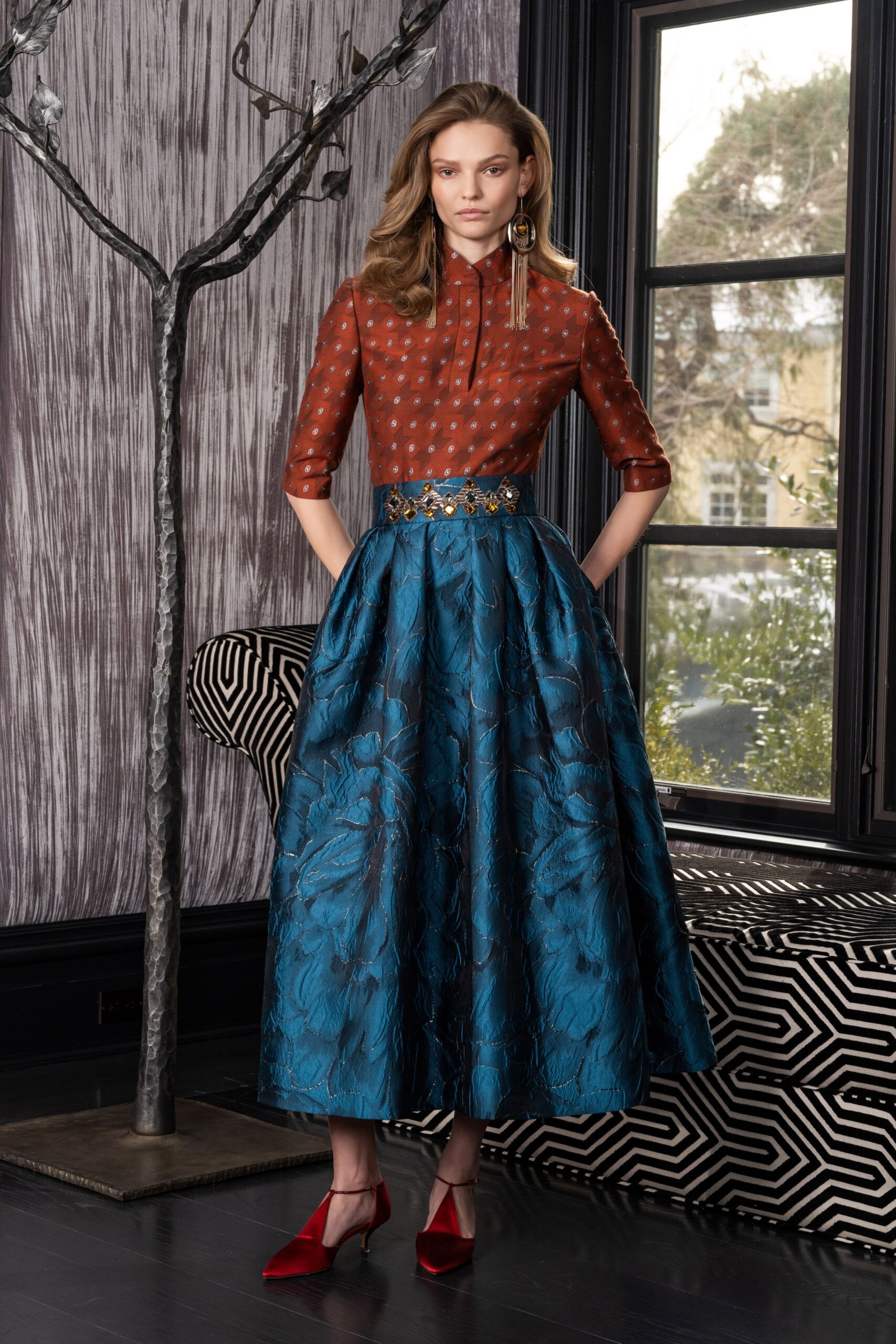 brown polka-dot shirt blue flared skirt