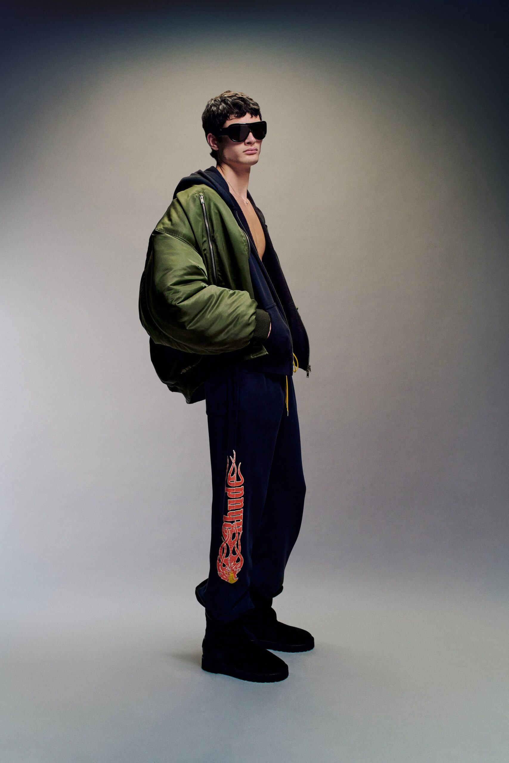 green jacket black hoodie relaxed outfit