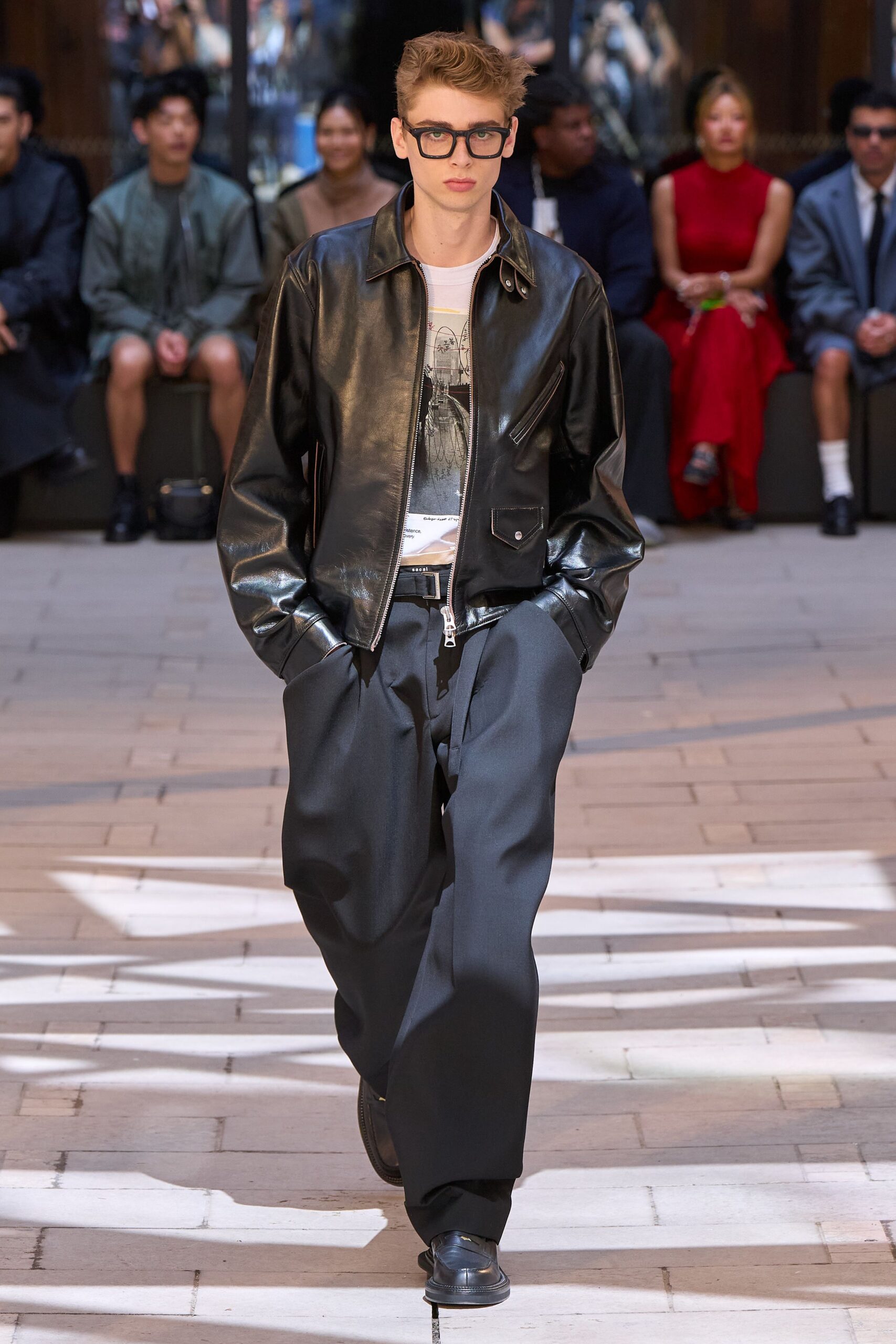 black leather jacket with gray pants