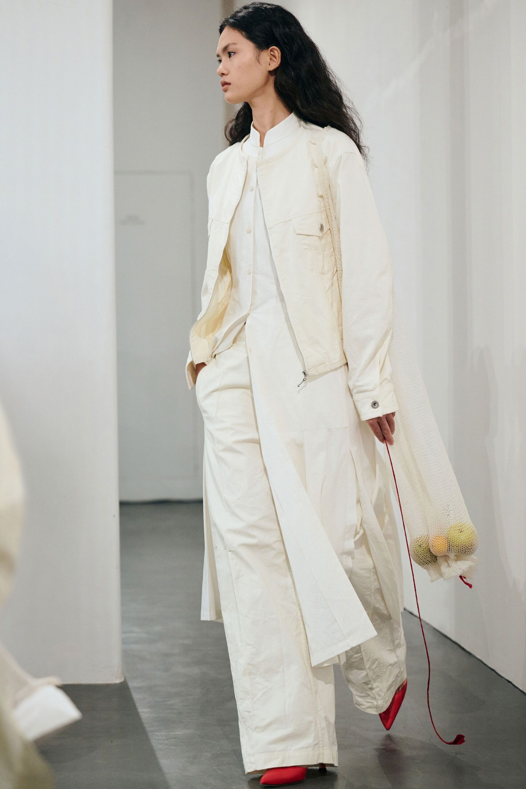 white relaxed coat with red shoes