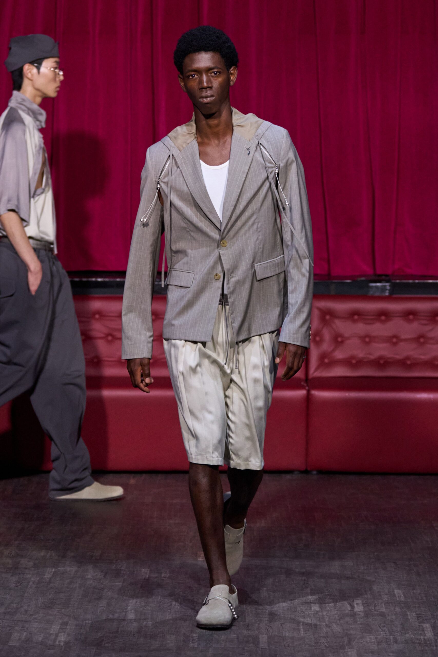 gray structured blazer with white shorts