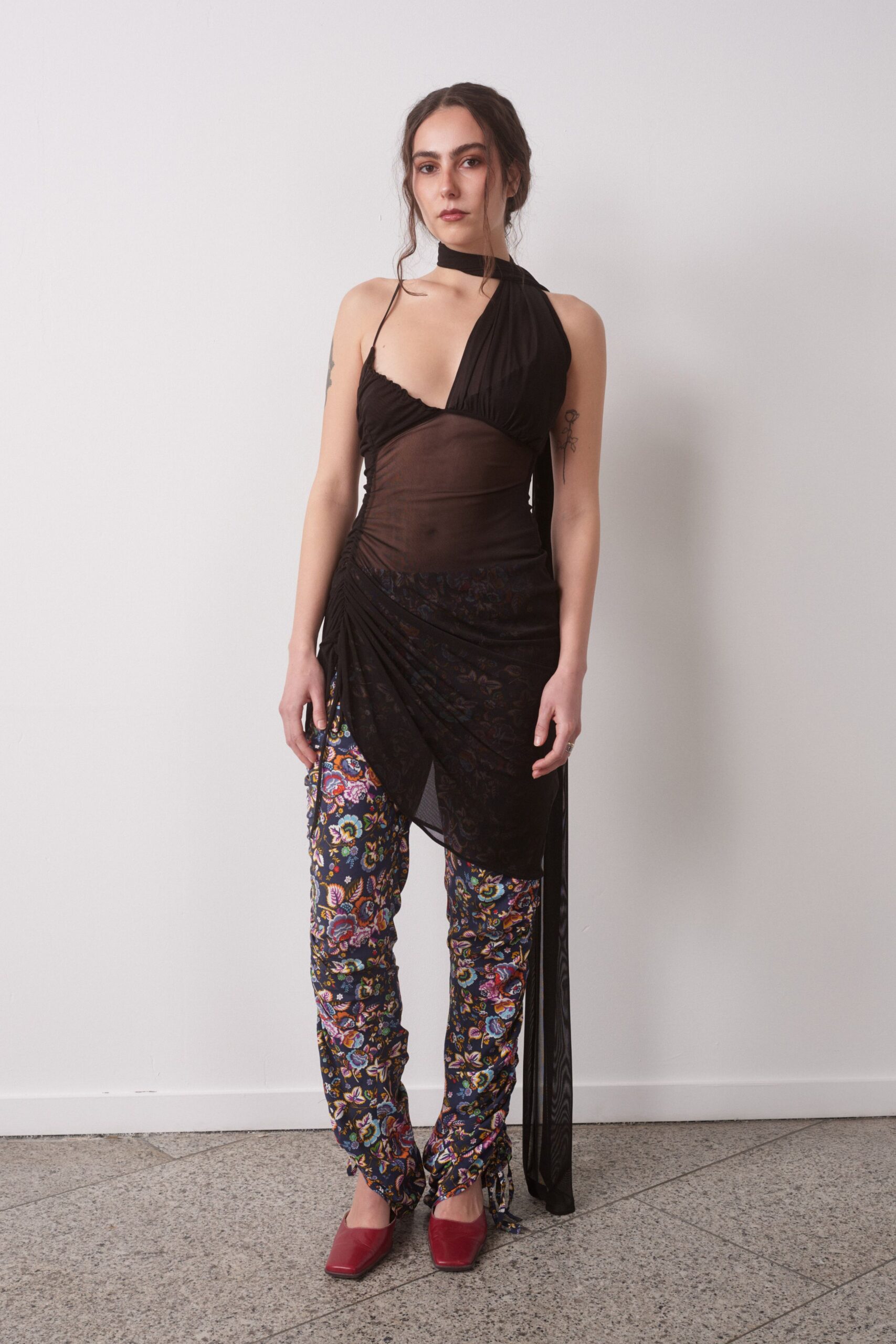 black fitted top with multi pants