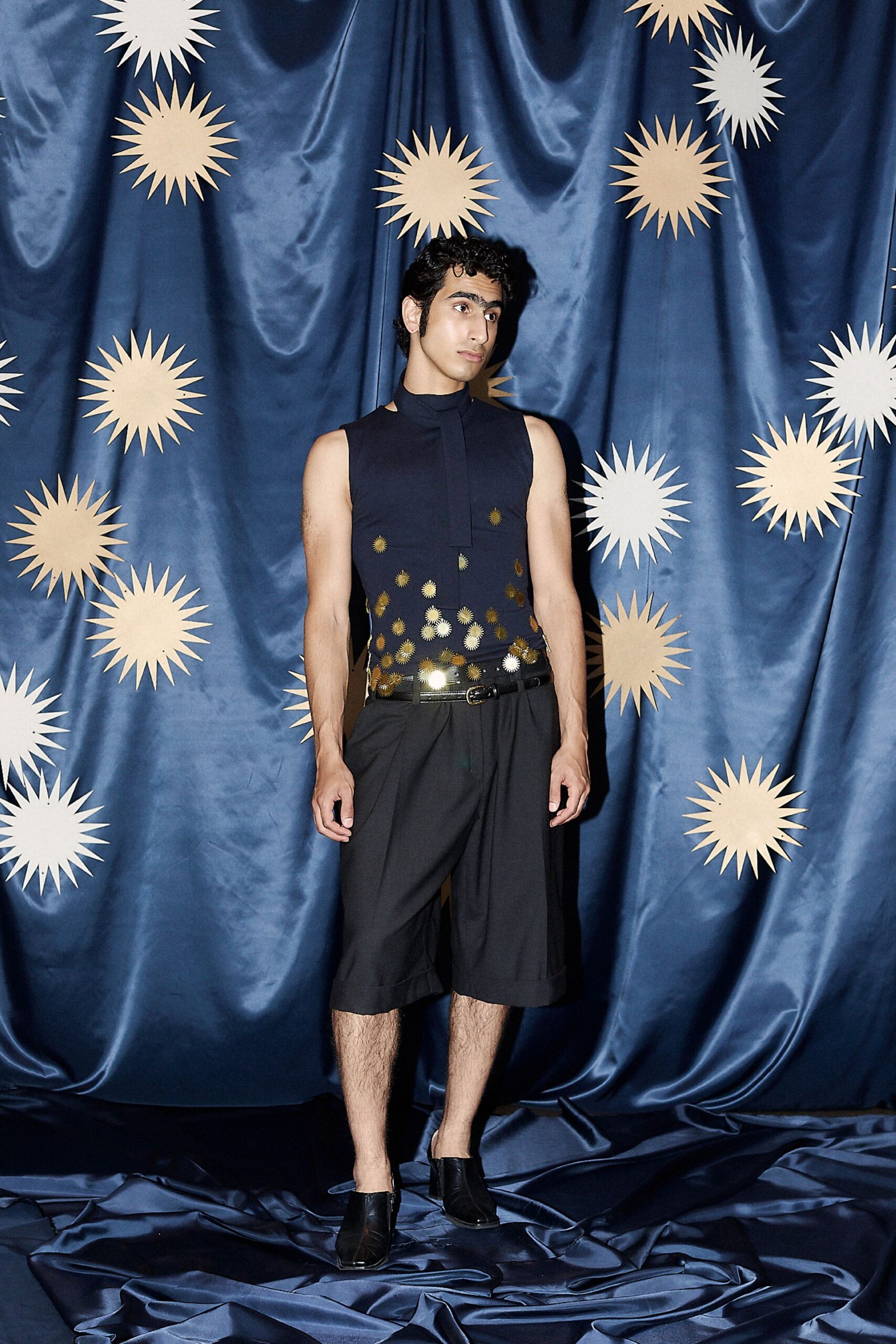black fitted top with pleated shorts