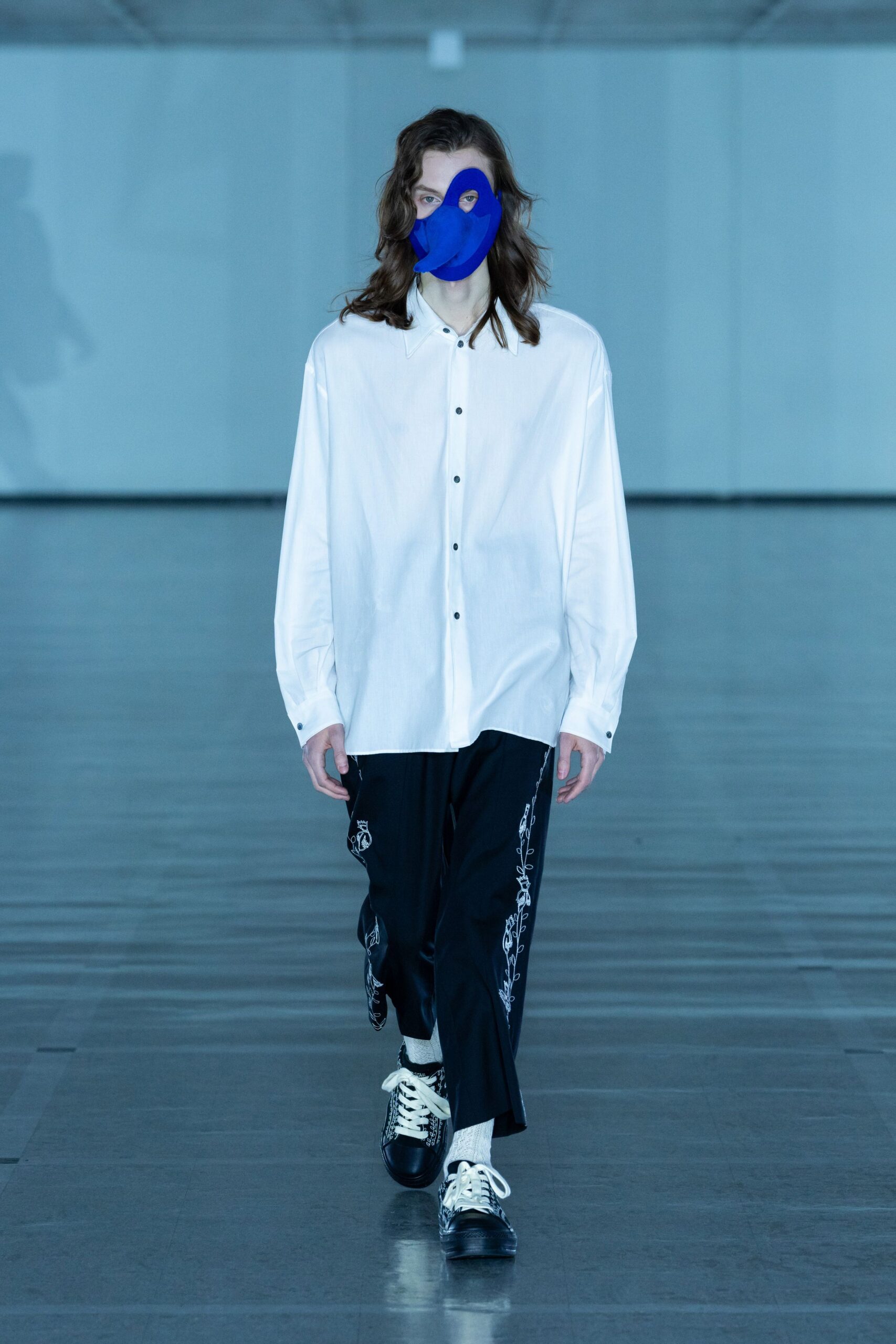 white relaxed shirt with black pants