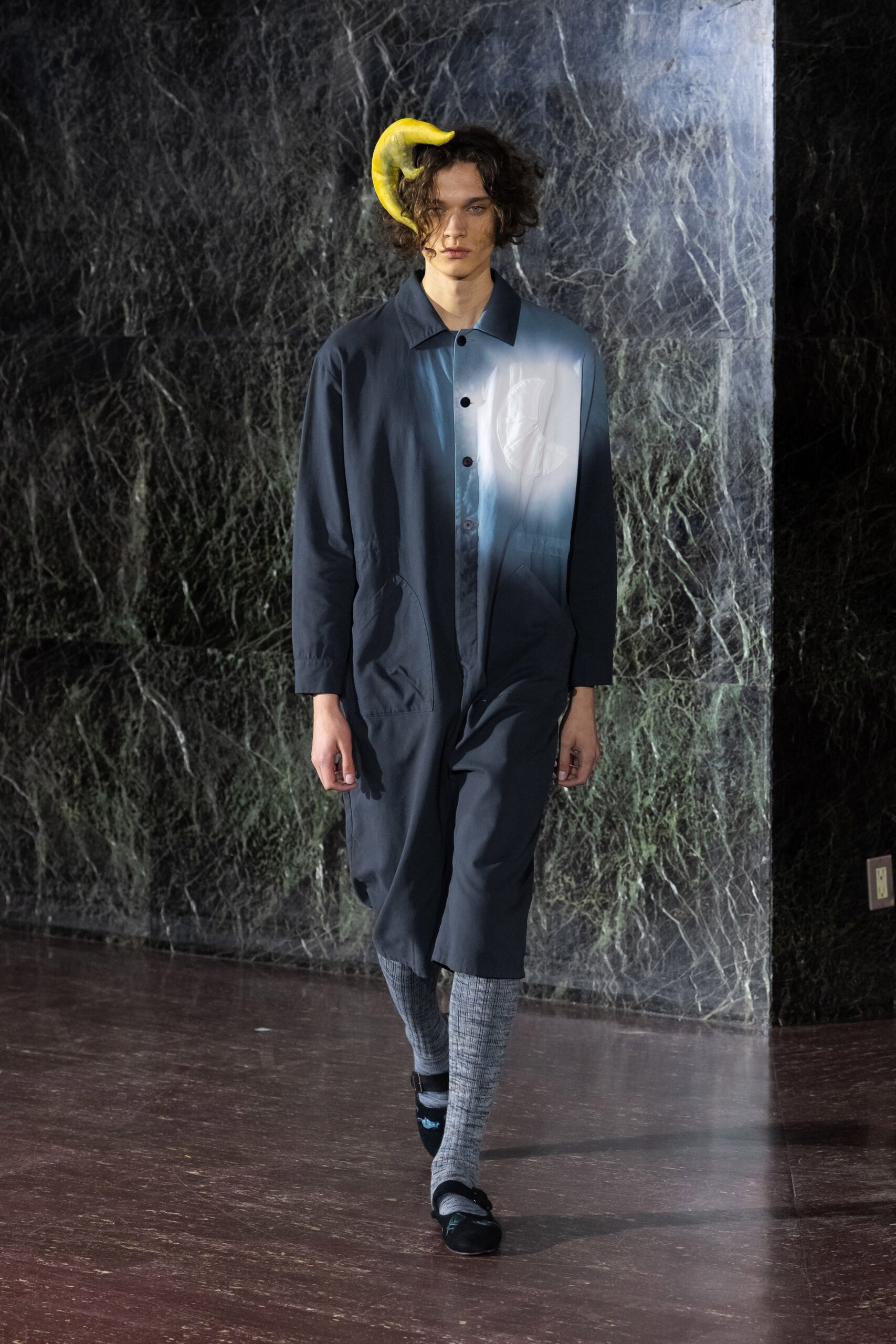 blue relaxed coat with gray pants
