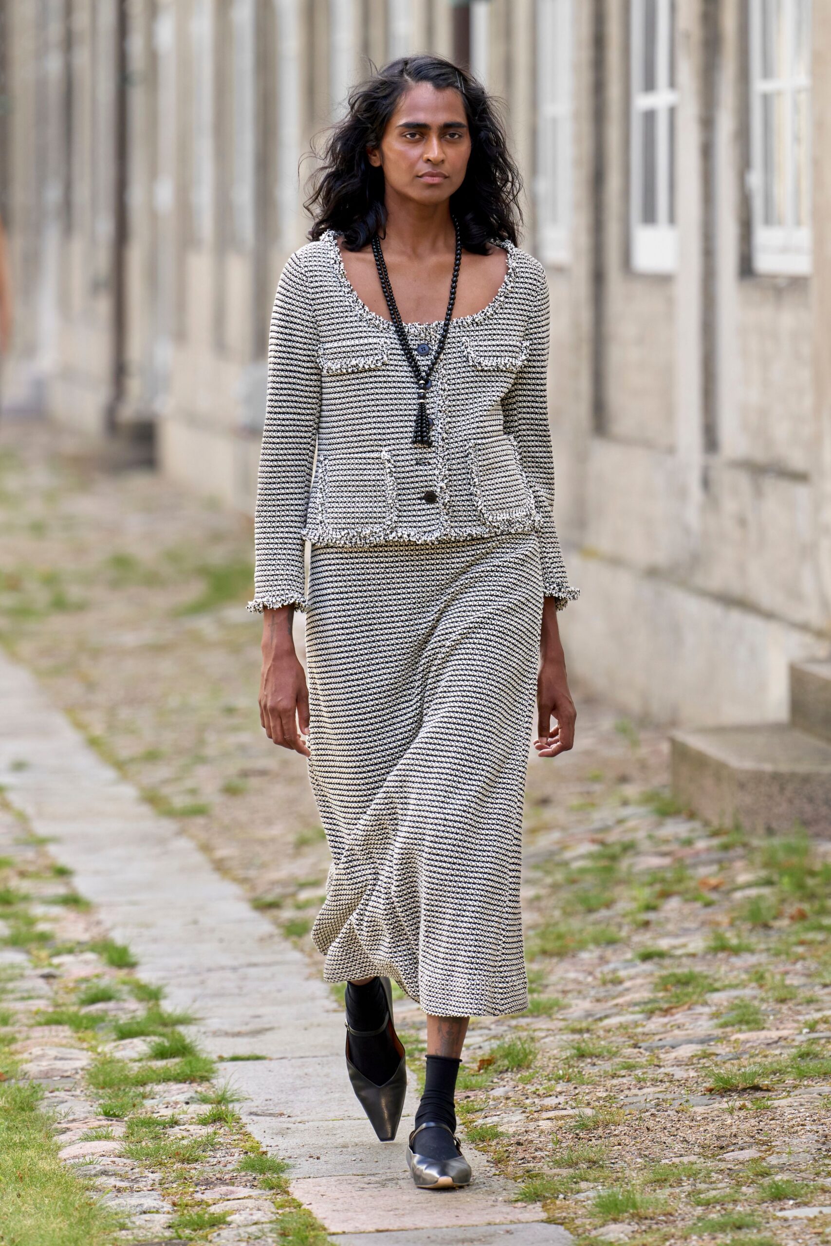 black cotton long-sleeve collared fitted buttoned layered jacket