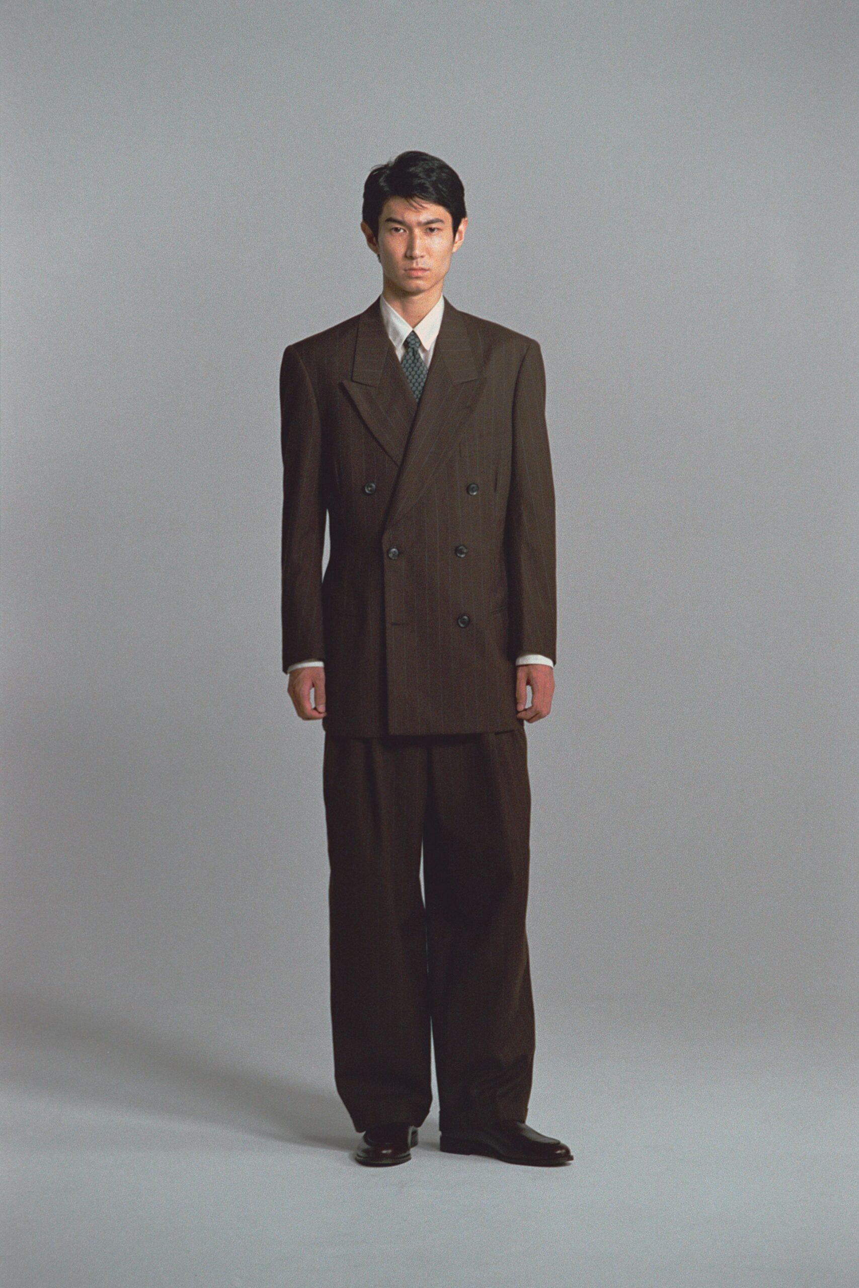 brown tailored suit with relaxed pants
