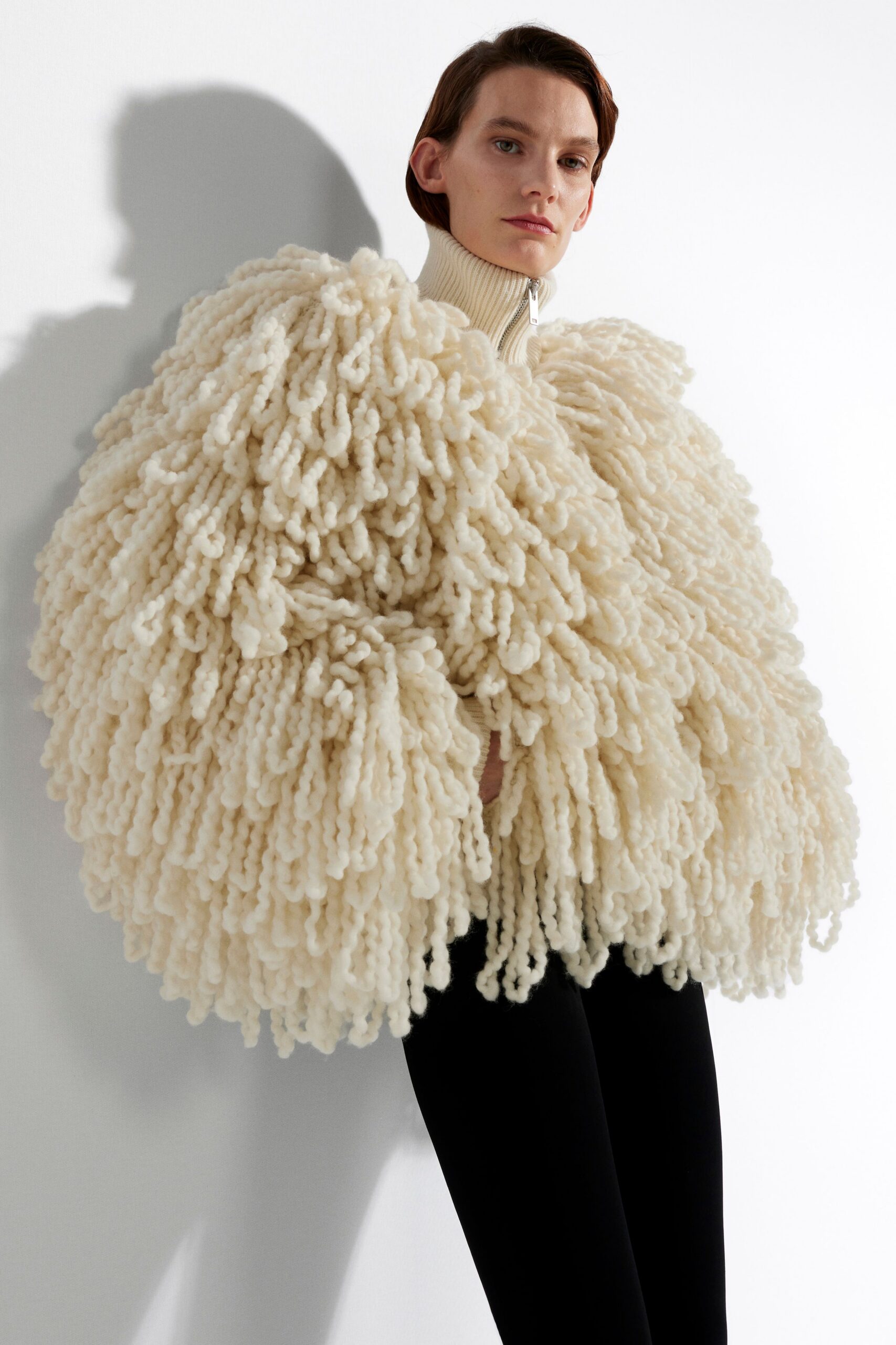 white wool long-sleeve high-neck oversized layered coat