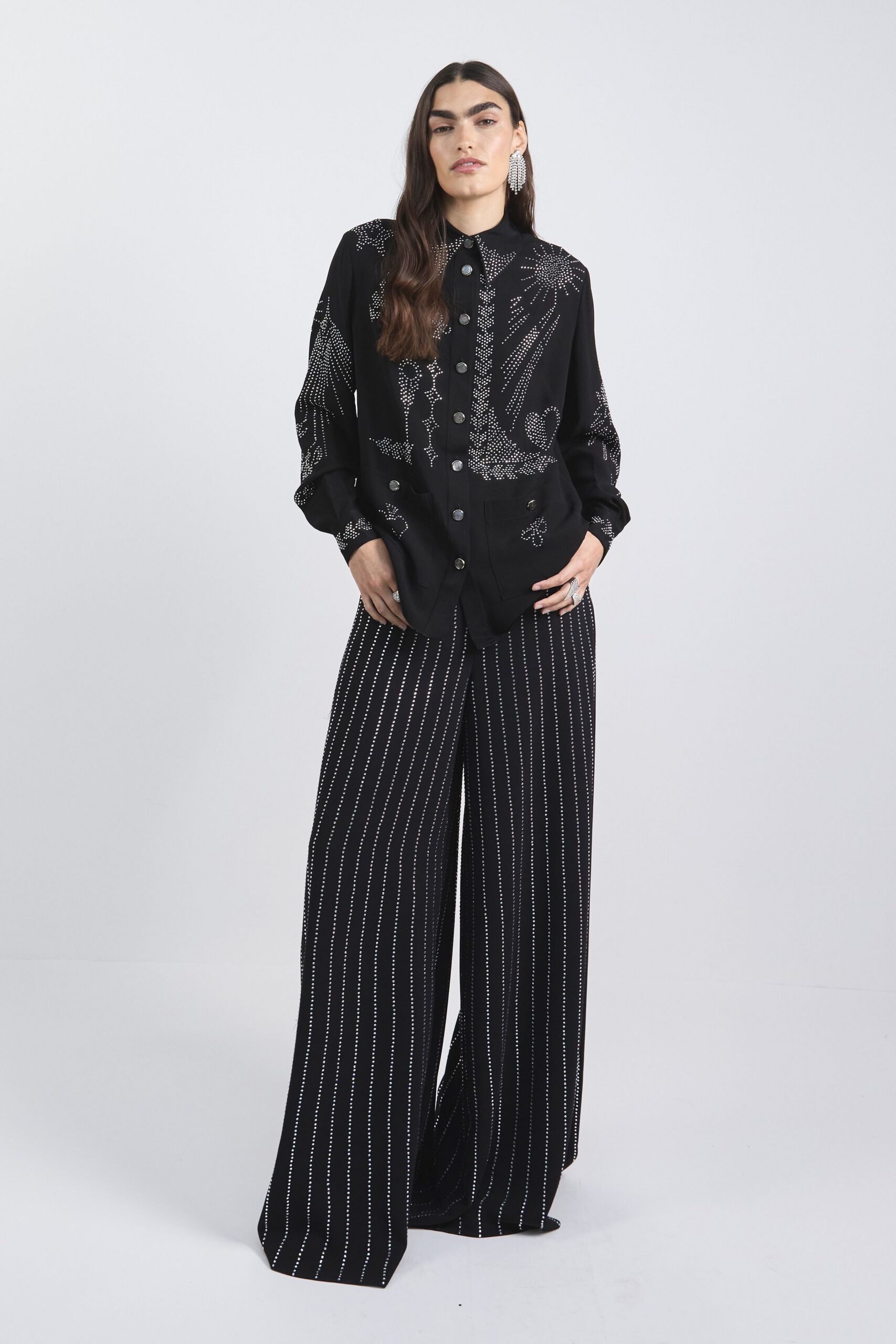 black embroidered shirt and striped pants