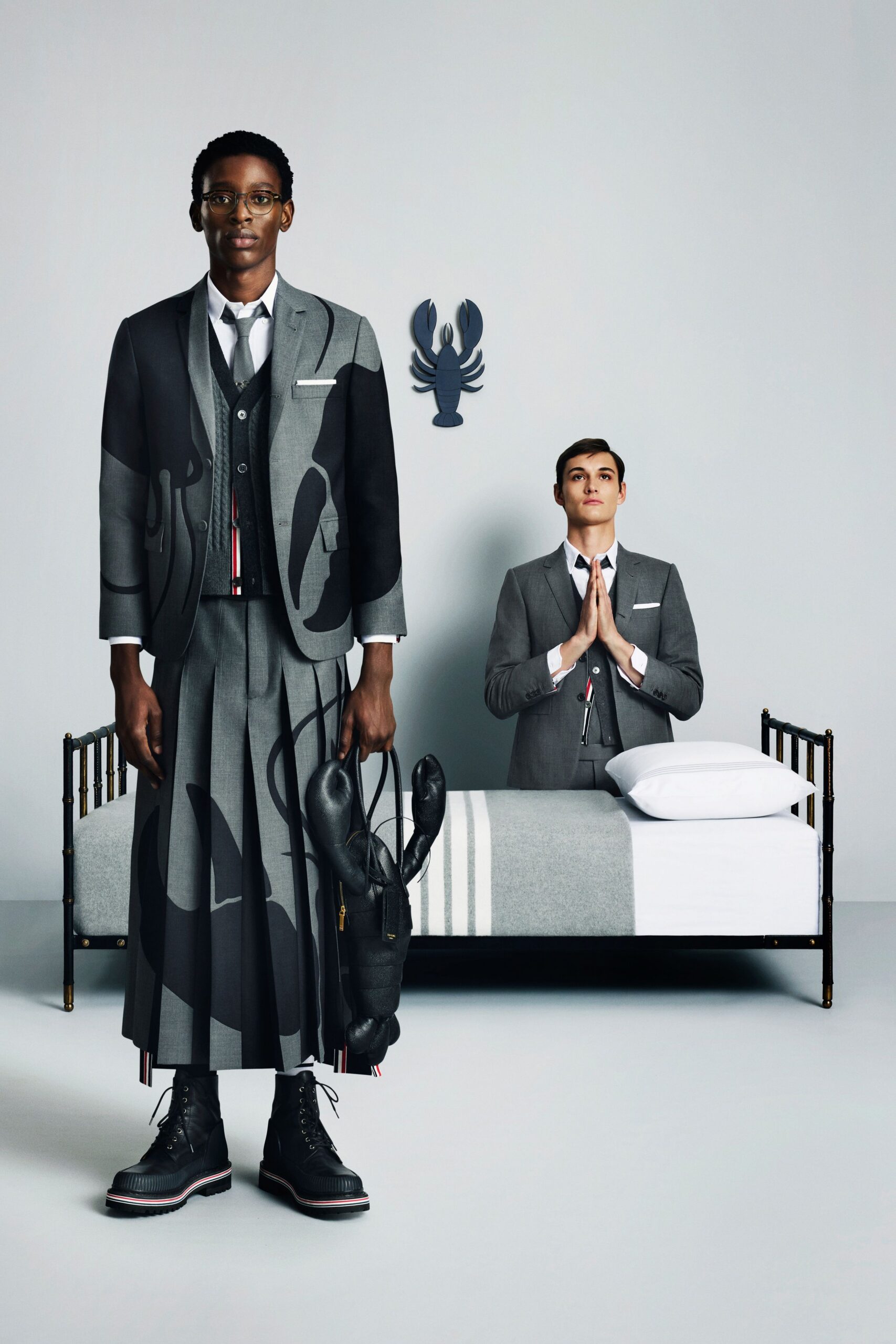 gray tailored suit with pleated skirt
