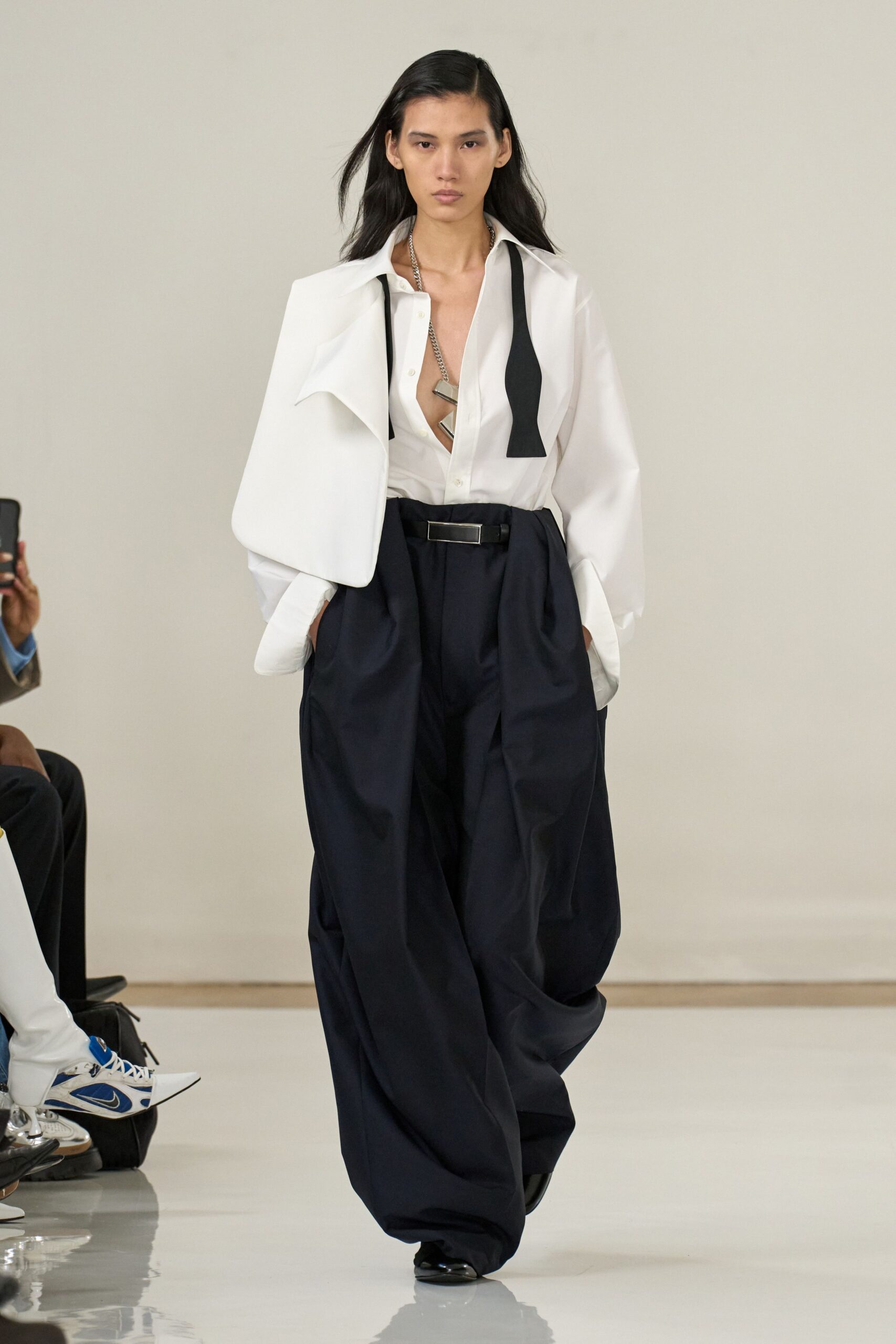 white relaxed shirt and black wide-leg pants