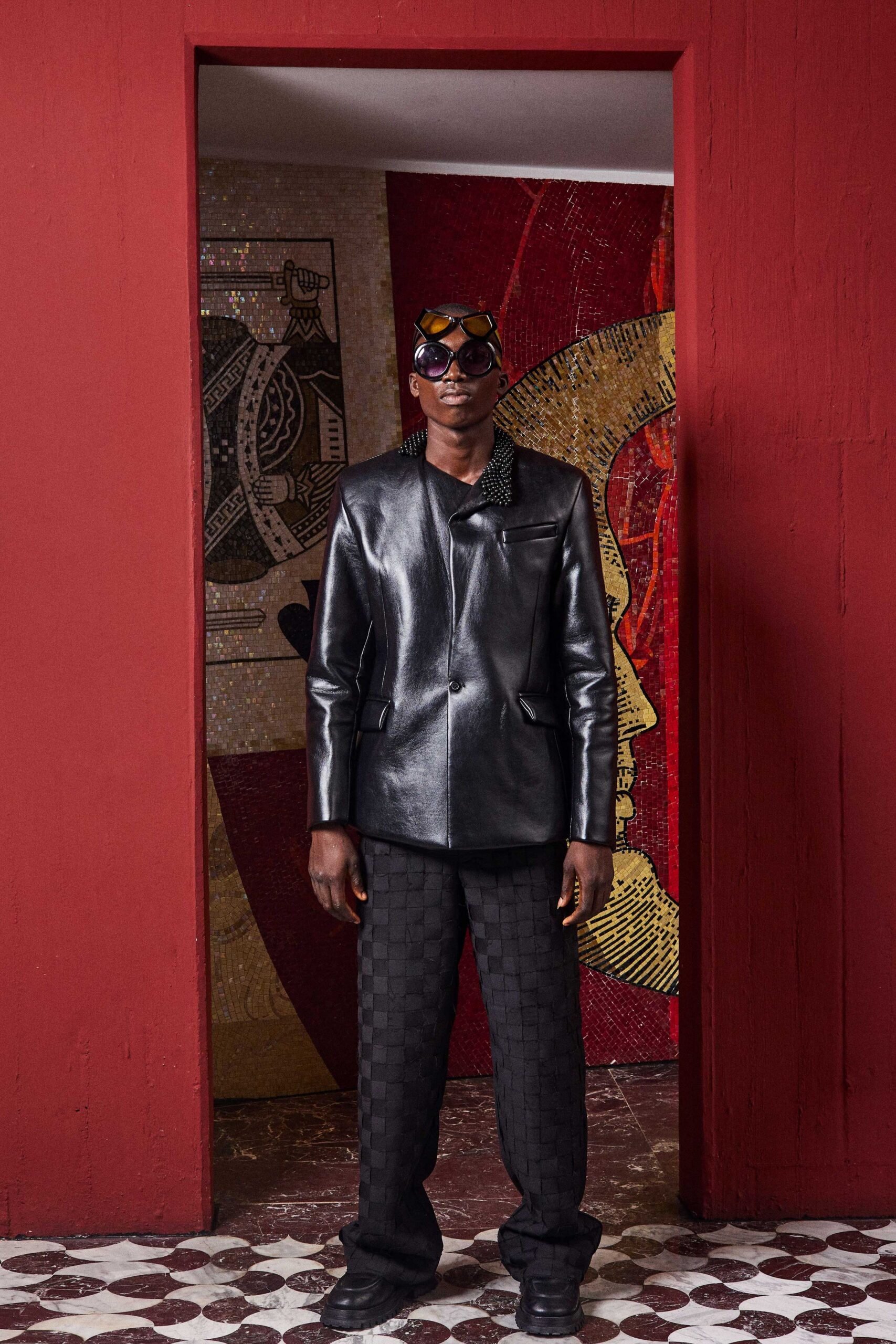 black leather jacket with checkered pants