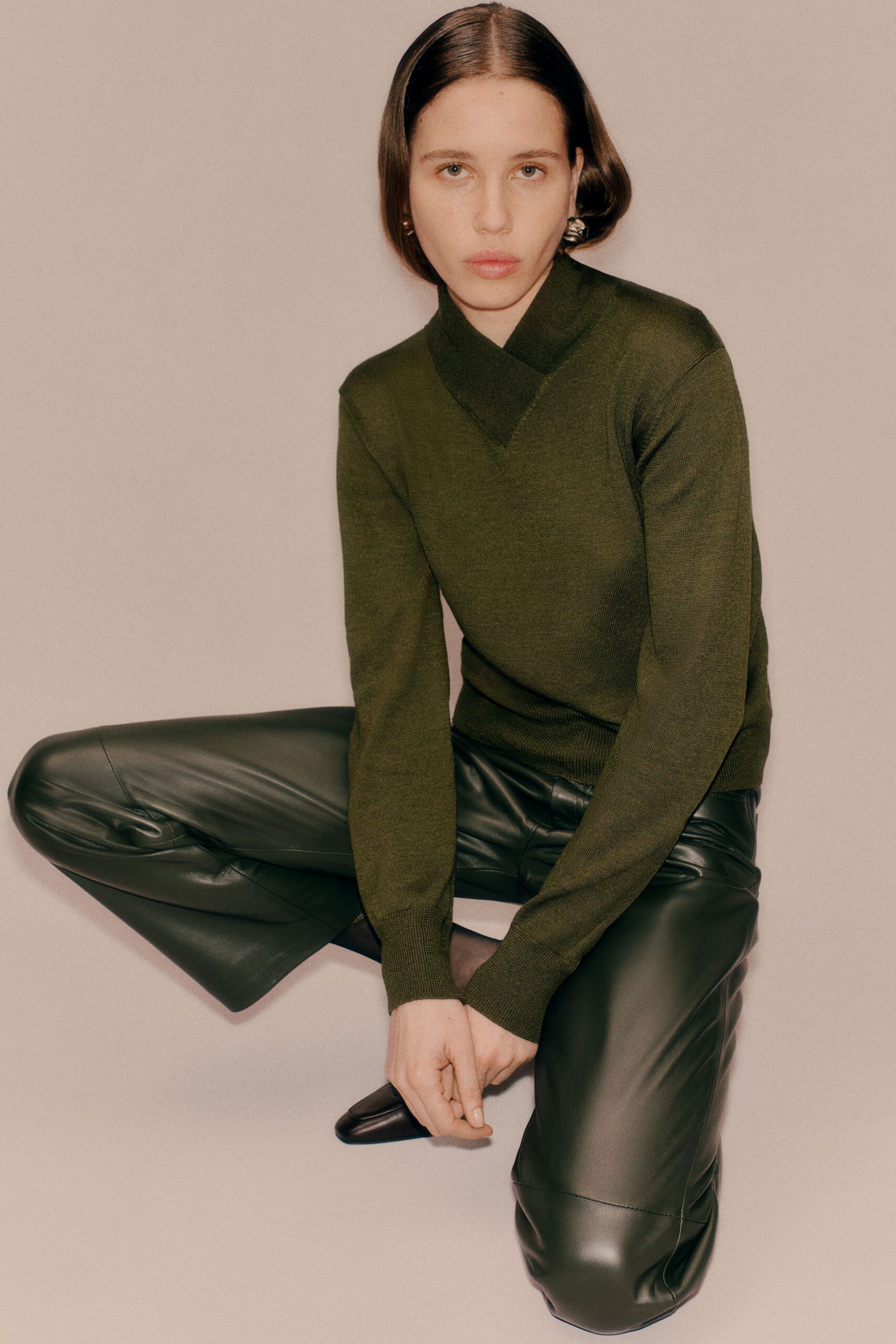 green wool long-sleeve v-neck fitted sweater