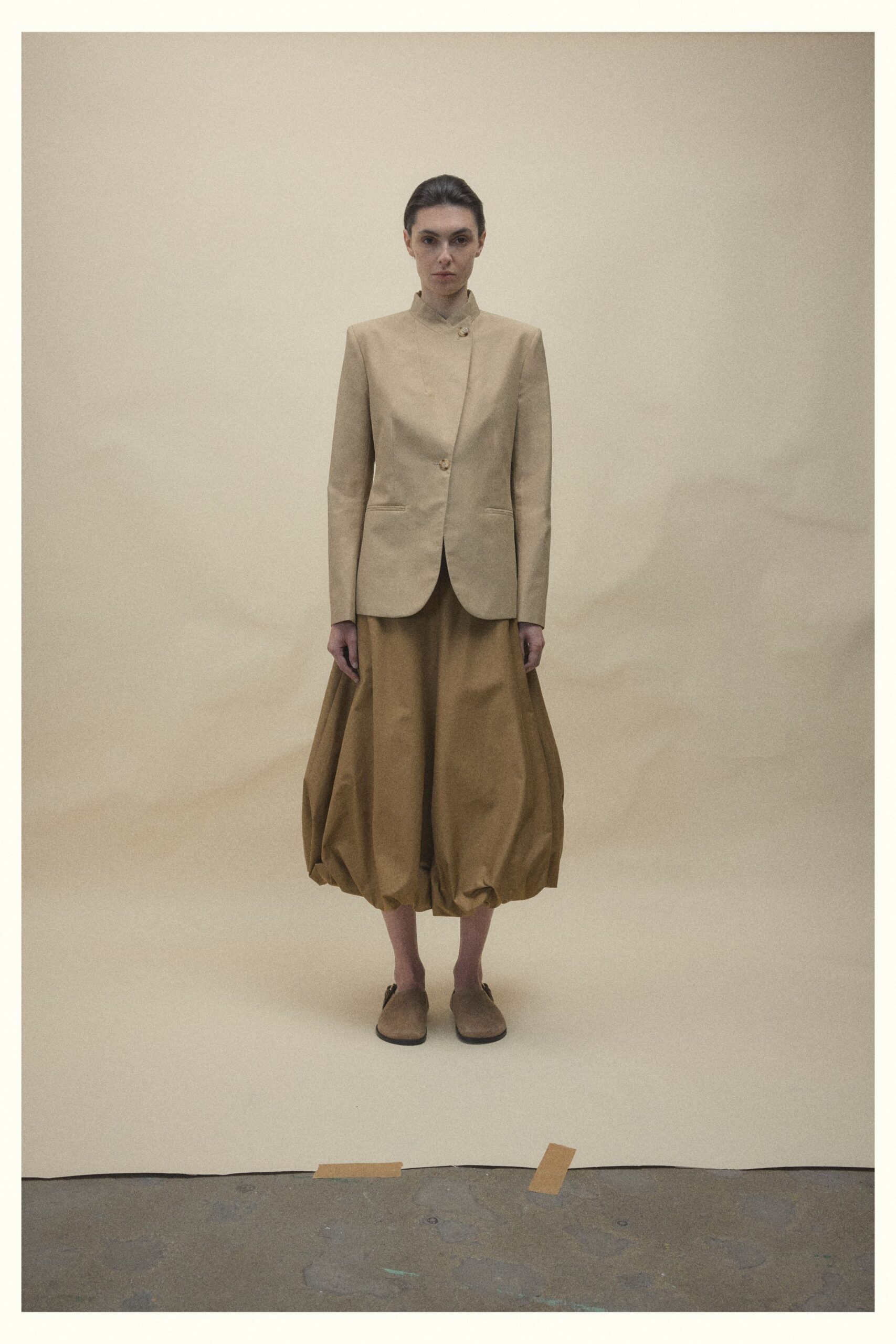 beige tailored blazer and relaxed skirt