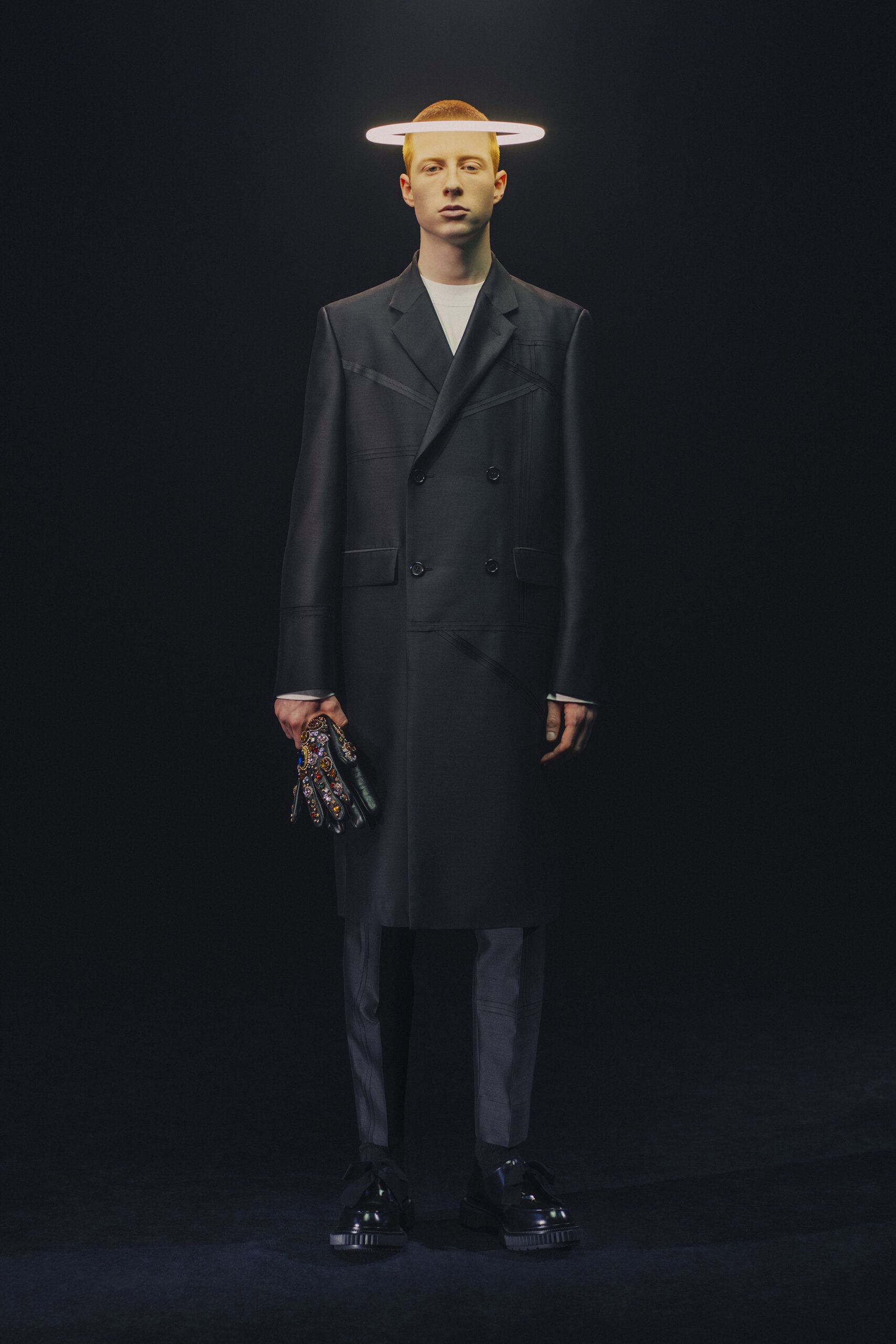 black tailored coat with gray pants