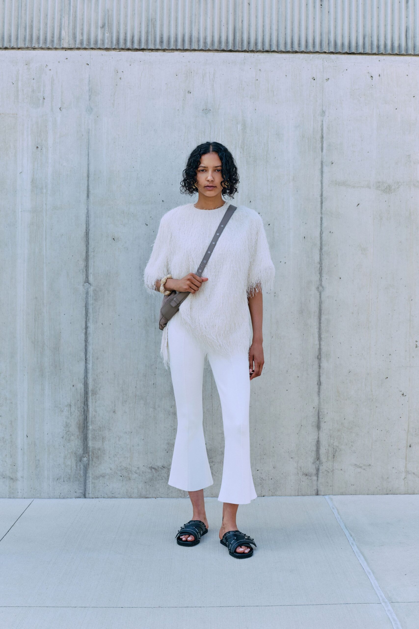 white relaxed top and flared pants